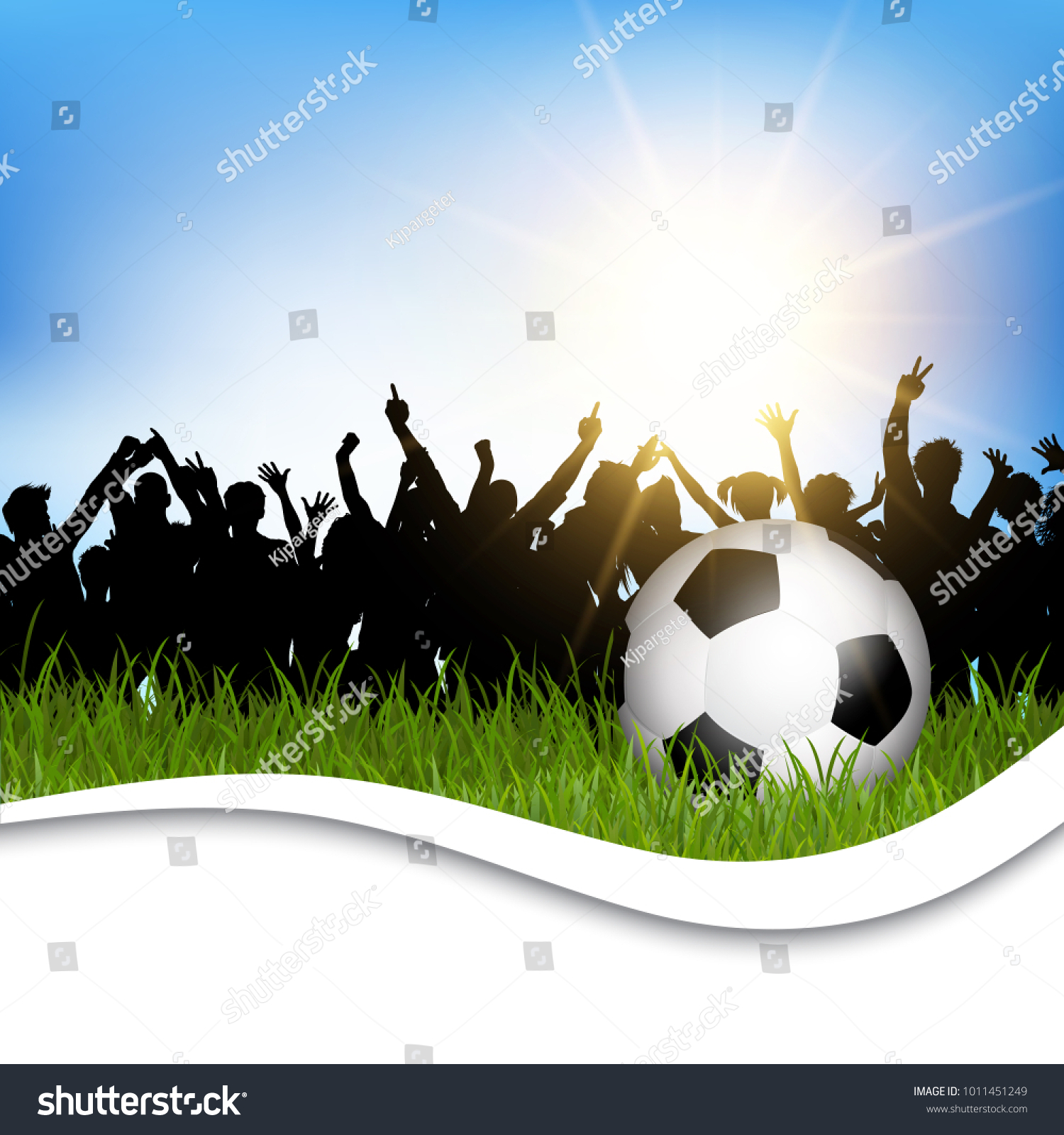 Football / soccer ball in grass with silhouette of cheering crowd #1011451249