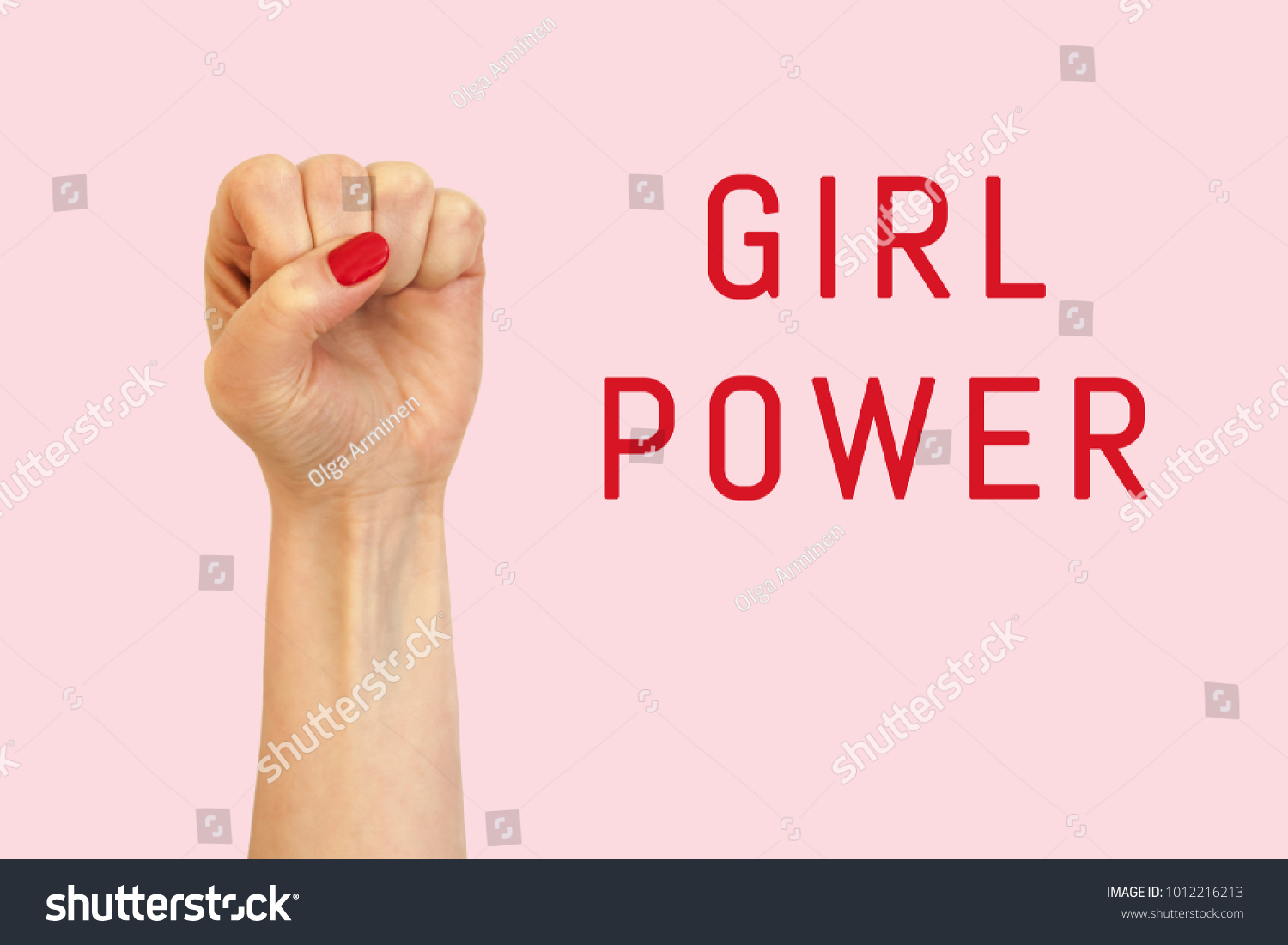 A woman hand on a pink background and inscription Girl power #1012216213
