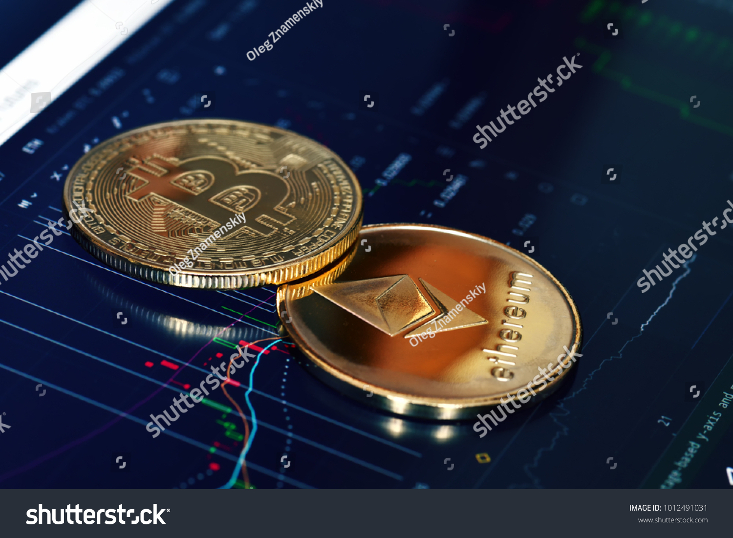 Bitcoin. Crypto currency Bitcoin, BTC, Bit Coin. Bitcoin and Ethereum golden coins on a chart. Blockchain technology, bitcoin mining concept #1012491031