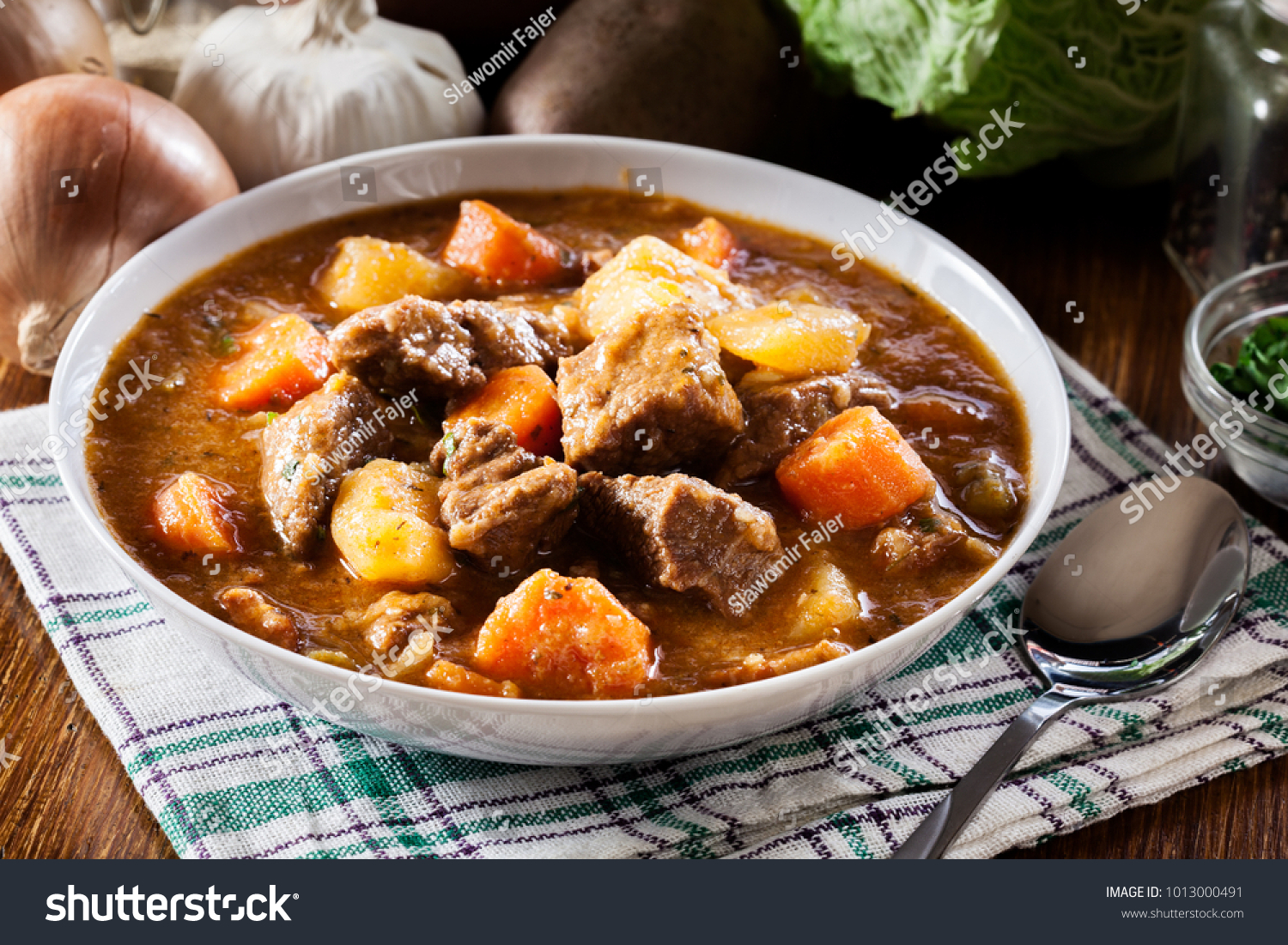 Irish stew made with beef, potatoes, carrots and herbs. Traditional  St patrick's day dish #1013000491