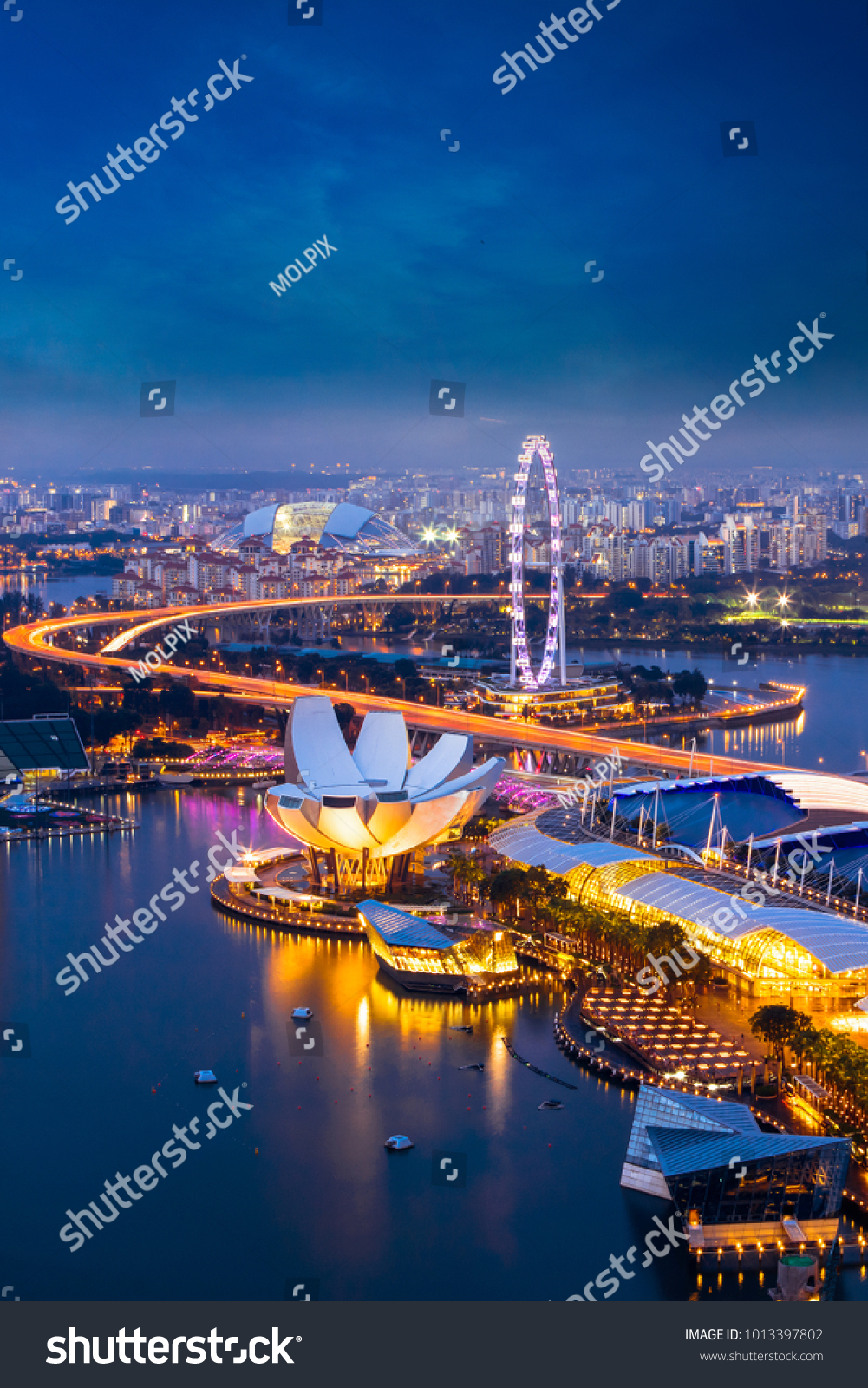 Singapore cityscape at dusk. Landscape of Singapore business building around Marina bay. Aerial view of modern high building in business district area at twilight. #1013397802