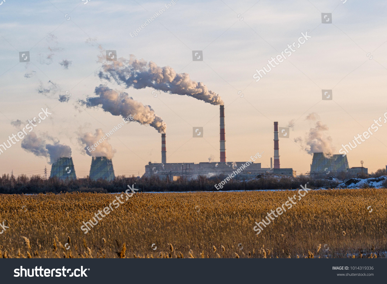 The factory emits dirty smoke from the pipes #1014319336