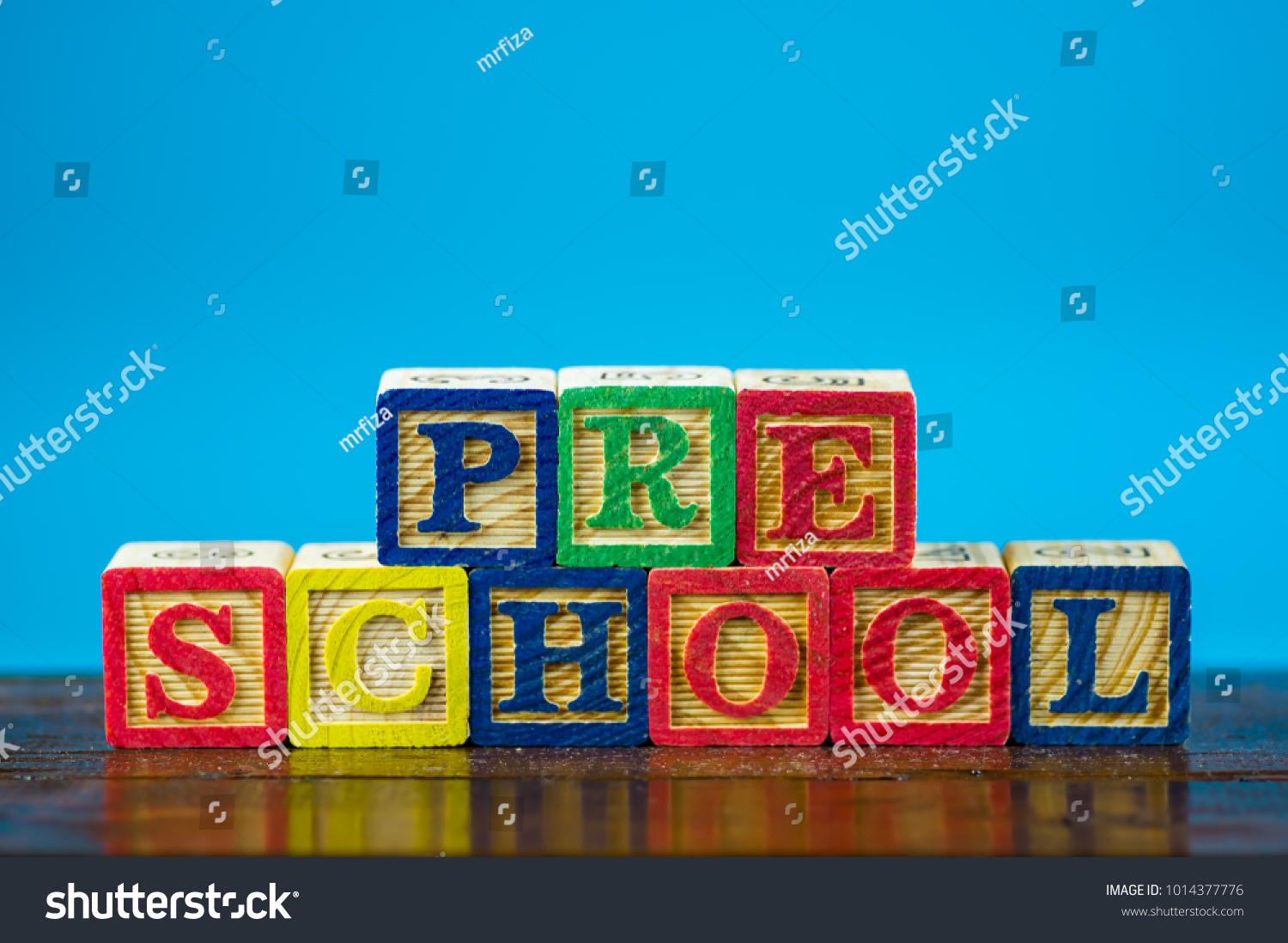 Close up arrangement of "Preschool" alphabet on blue background. Preschool, education and copy-space concept or other your content. #1014377776
