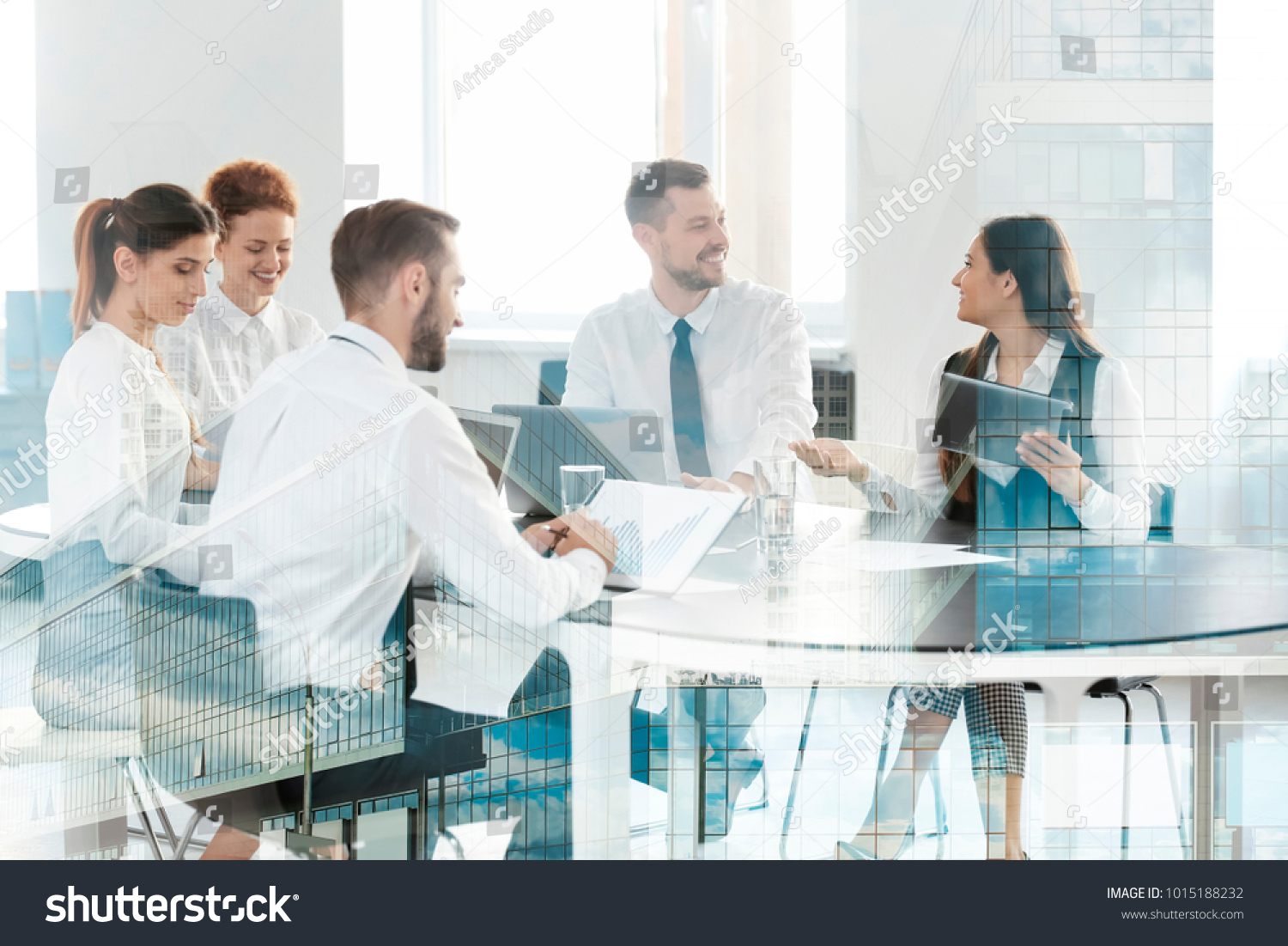 Double exposure of cityscape view and people working at table in office. Concept of financial trading #1015188232