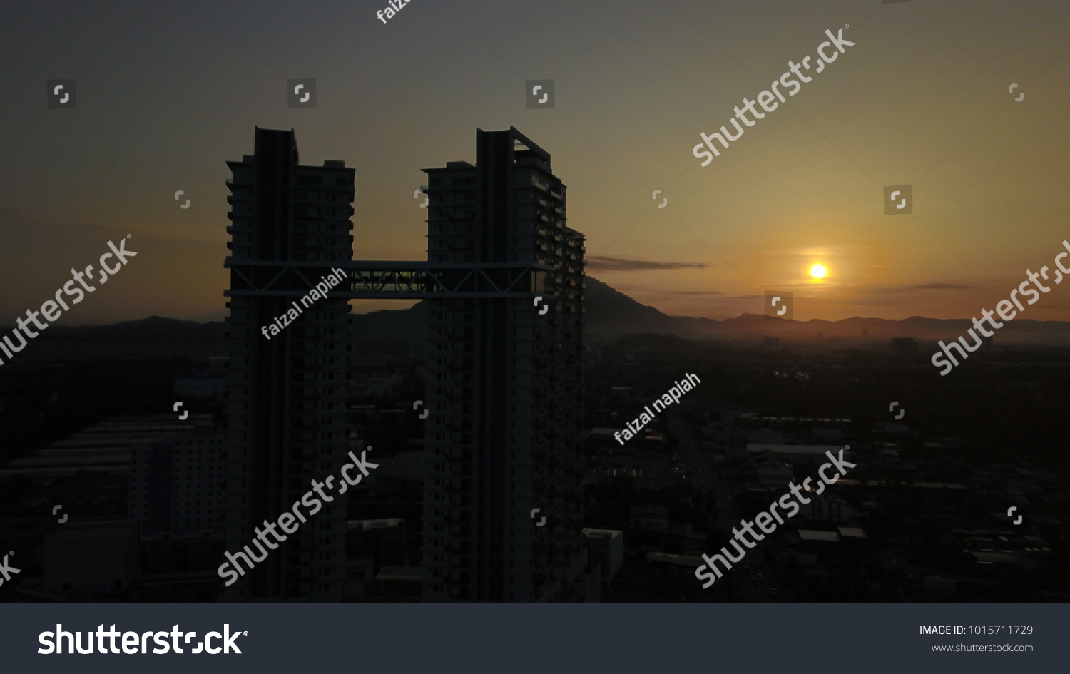 Construction of high-rise buildings on backgroun sunrise #1015711729