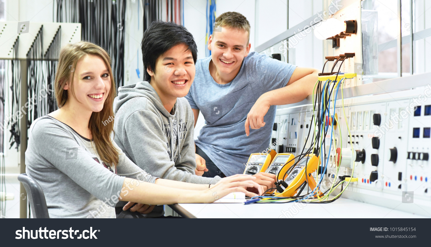 group of cheerful young students in vocational education and training for electronics  #1015845154