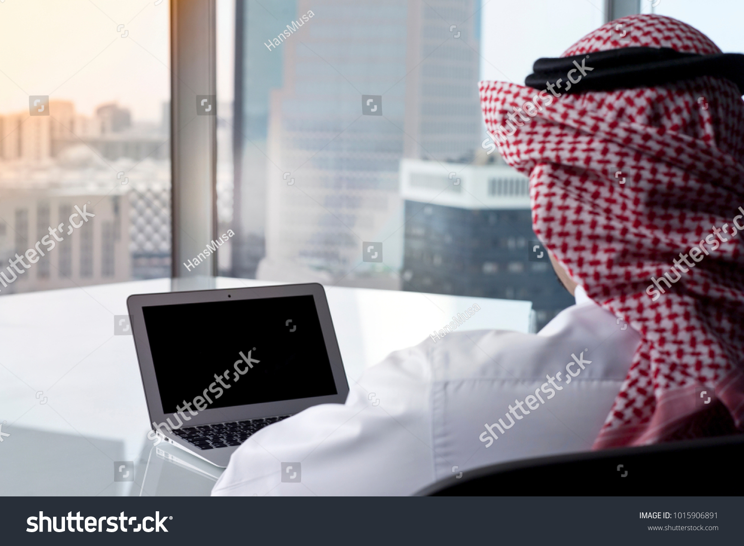 Saudi Arab Man Watching Laptop at Work and Contemplating #1015906891