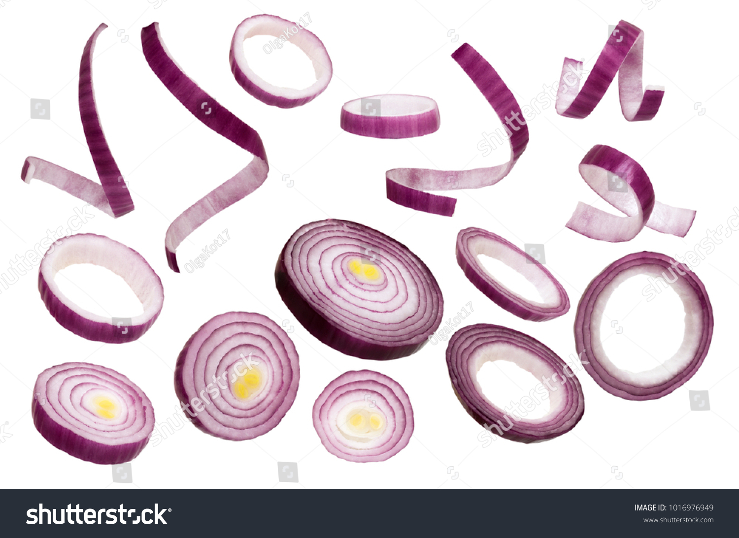 Sliced red onion isolated on white background. Set of red onion slices isolated on a white background.  Closeup #1016976949