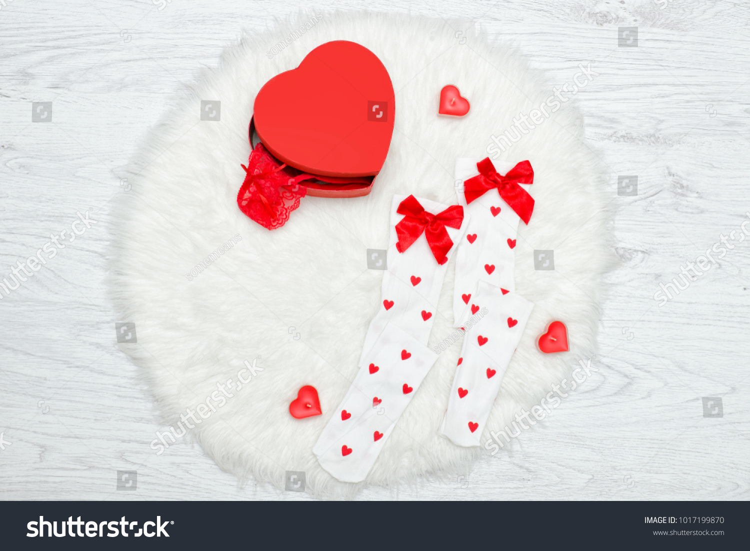 Fashion concept. White stockings and box in the shape of heart. White fur #1017199870