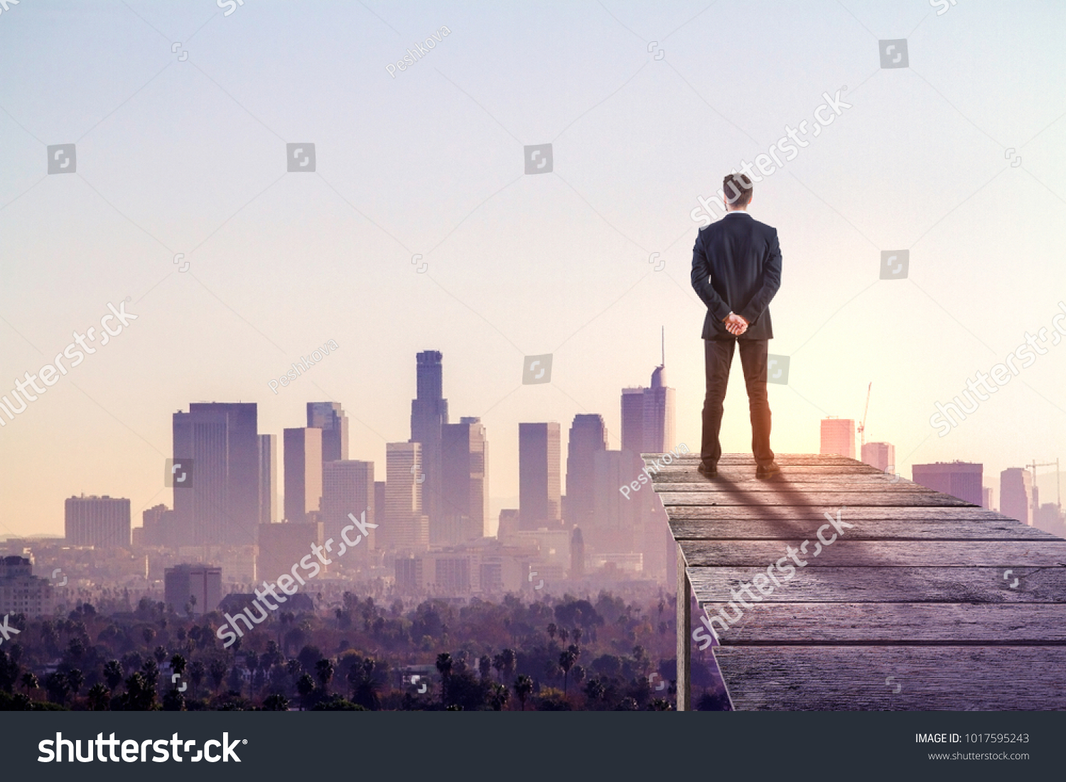 Thoughtful businessman on abstract city background. Research and employment concept #1017595243
