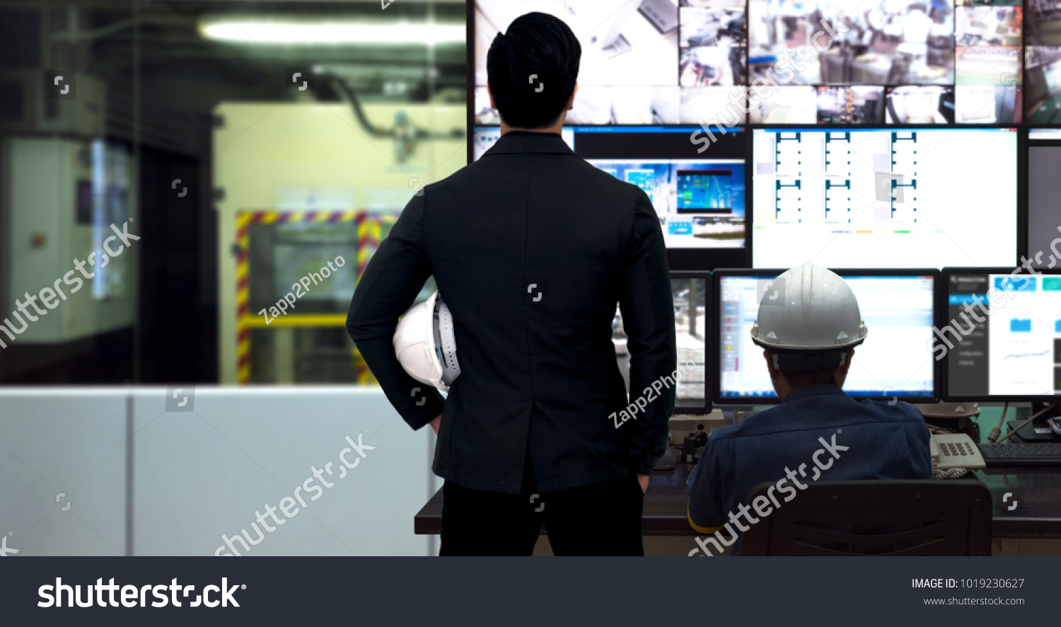 Process Control room and Industrial Automation in industry 4.0 technology trend concept. Engineer and director manager monitoring real time work automation machine process in smart factory. #1019230627