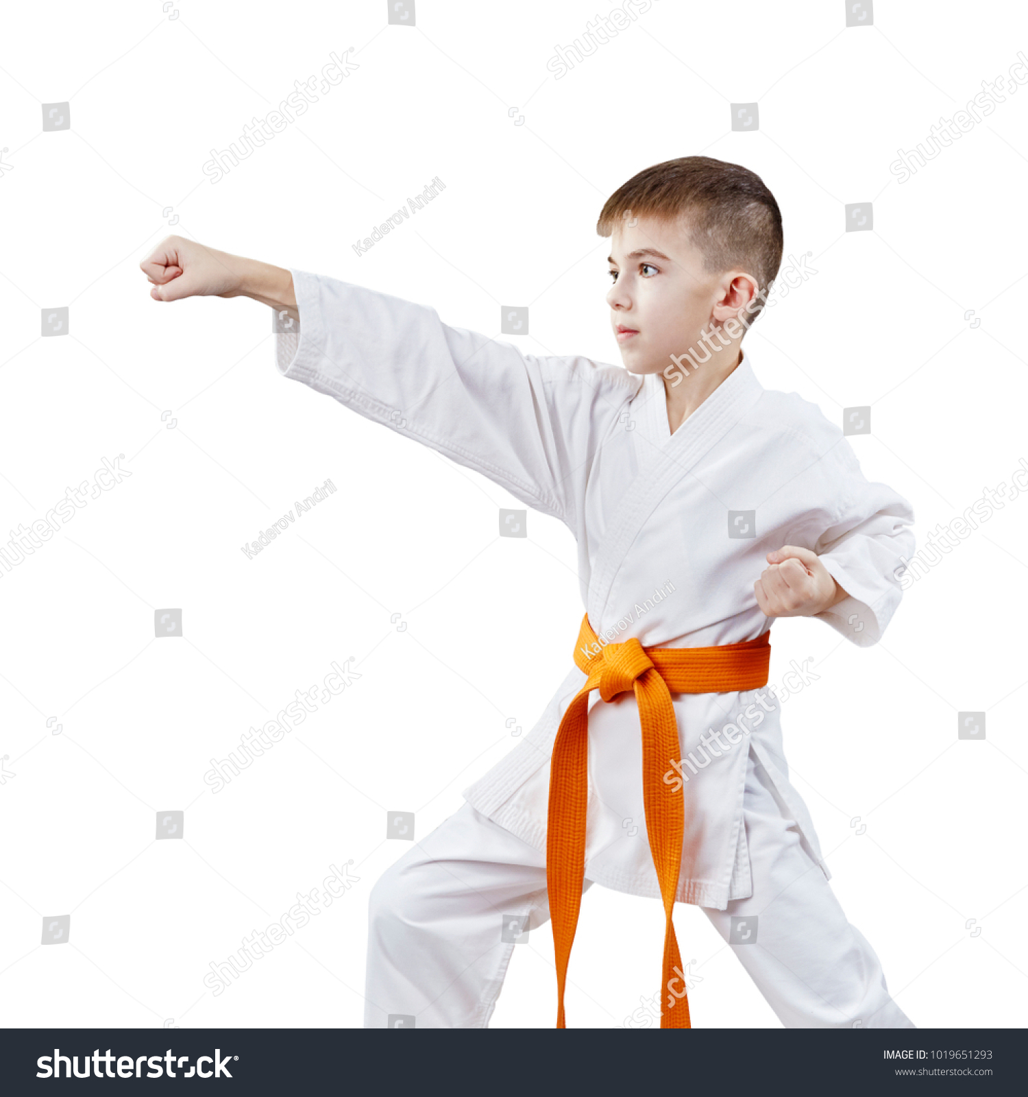 In karategi, the boy sportsman strikes with a hand #1019651293