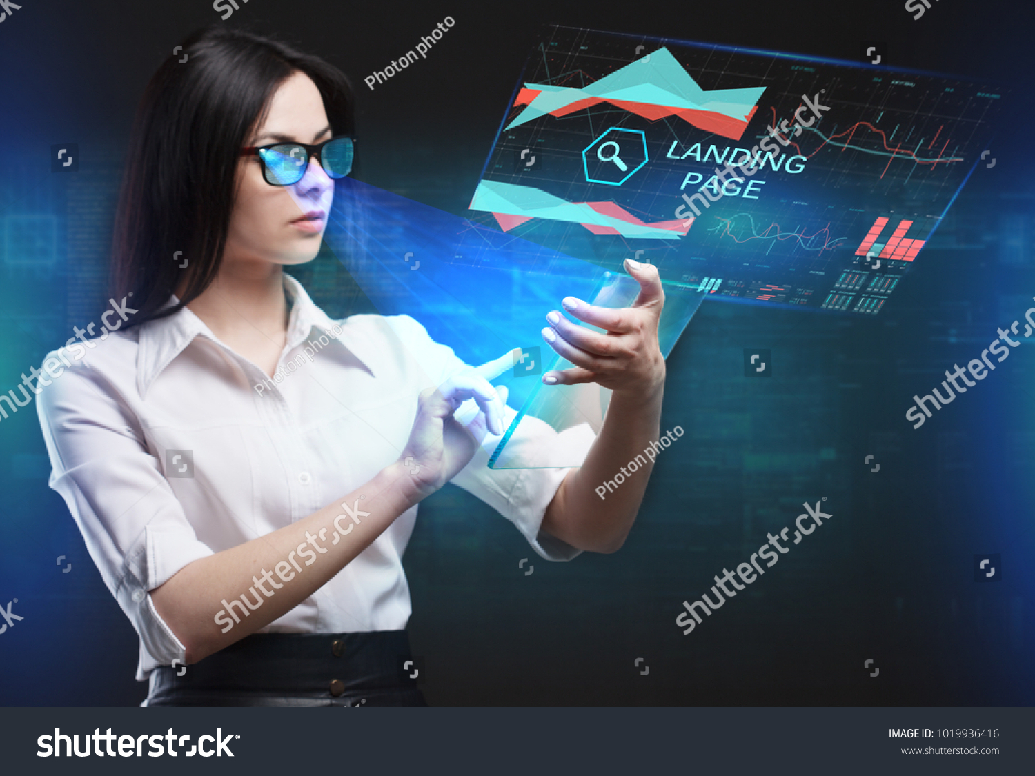 The concept of business, technology, the Internet and the network. A young entrepreneur working on a virtual screen of the future and sees the inscription: Landing page #1019936416