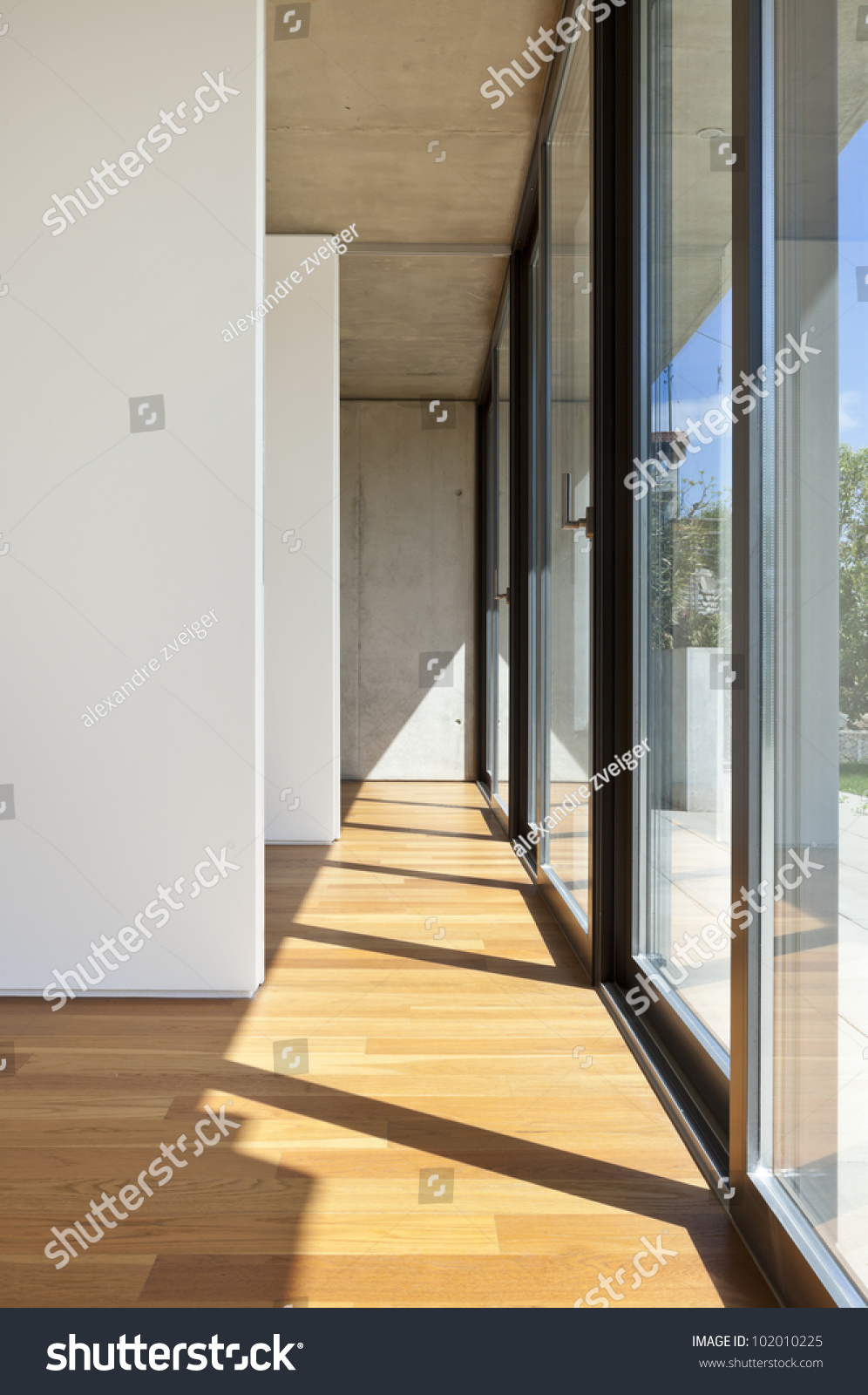 modern concrete house with hardwood floor, large window #102010225