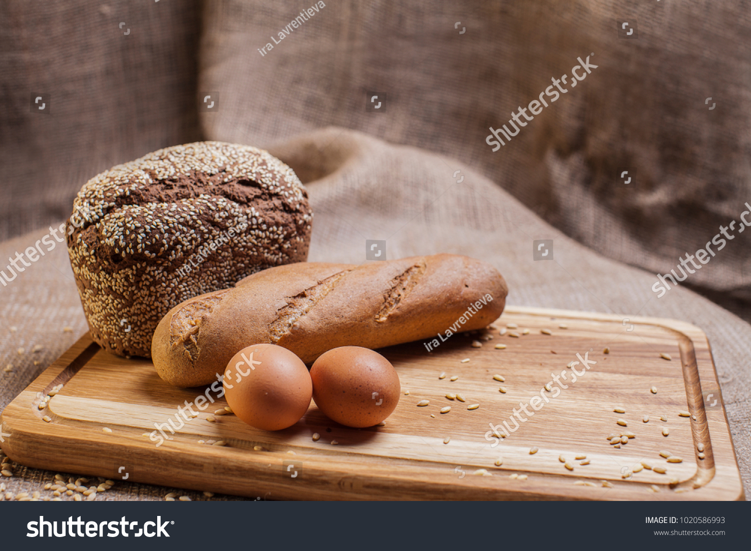 
loaf of bread on a wooden board #1020586993