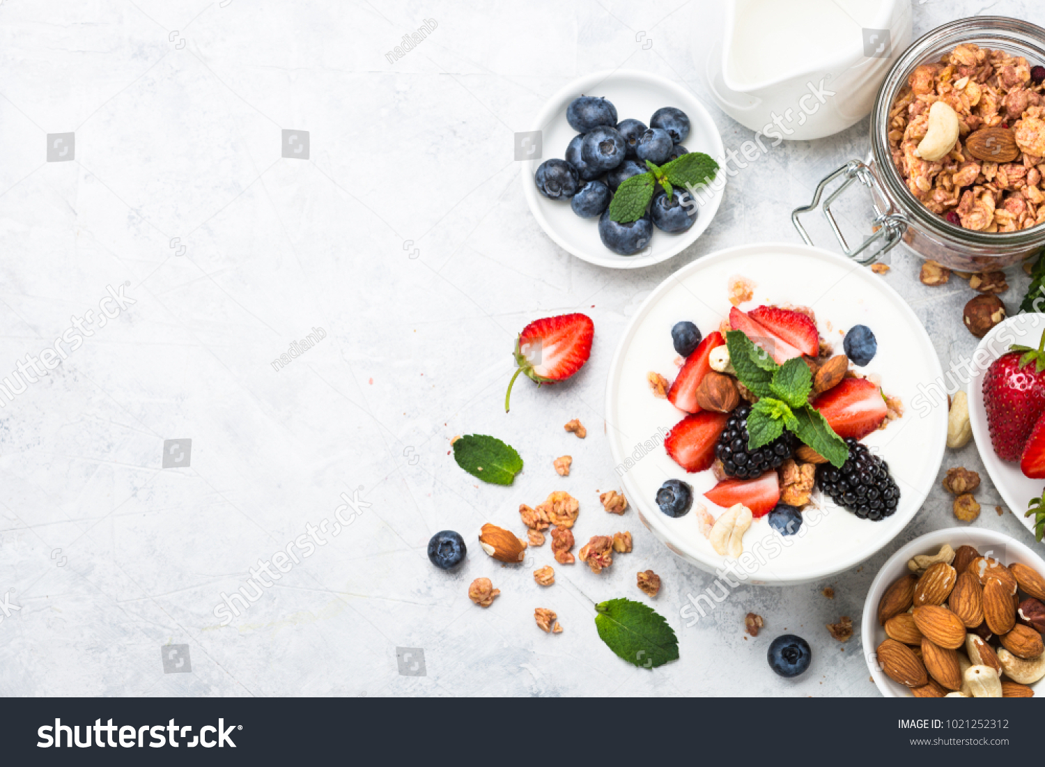 Greek yogurt granola and berry mix. Top view. #1021252312