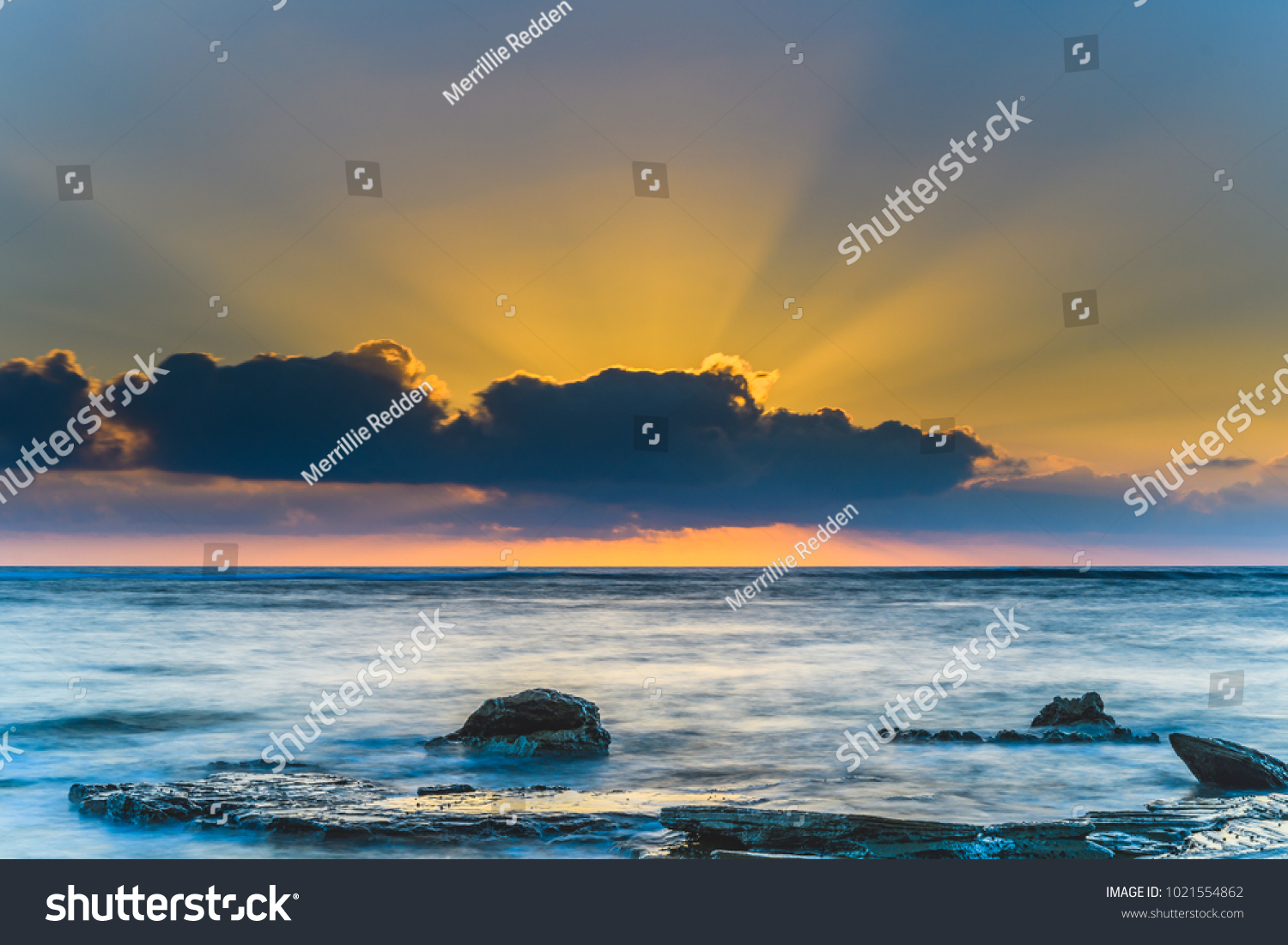 Sunrise Seascape and Sun Rays -
 Capturing the sunrise from Toowoon Bay Beach on the Central Coast, NSW, Australia. #1021554862