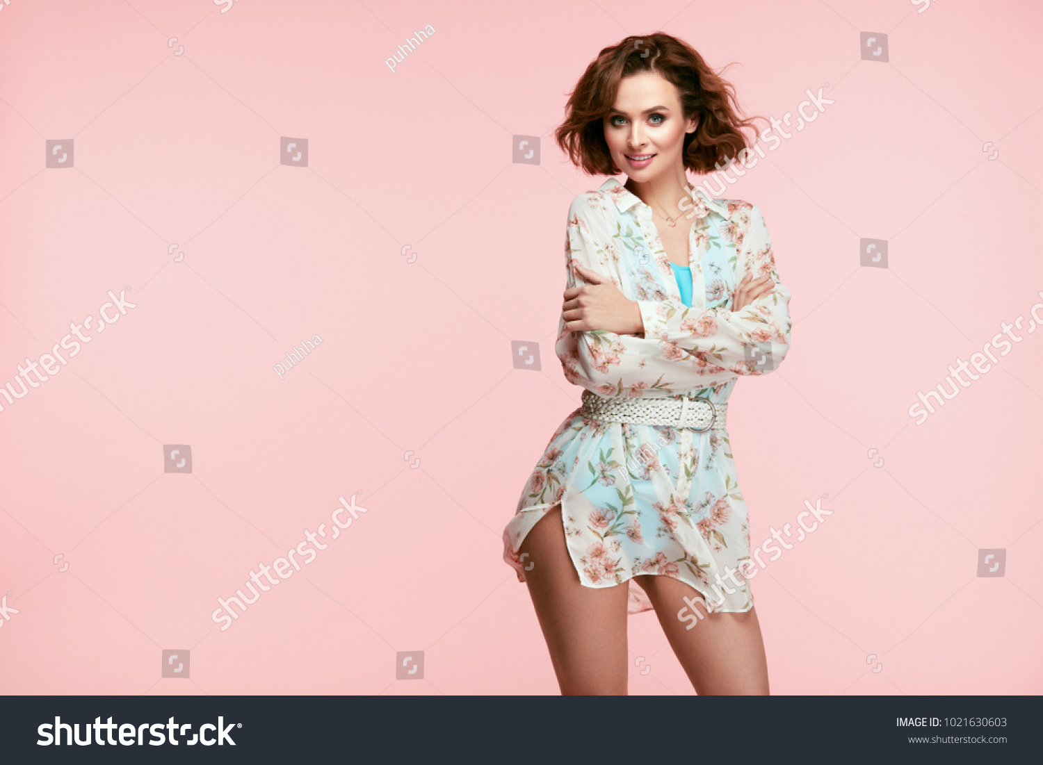 Women Fashion. Beautiful Girl In Stylish Clothes. Portrait Of Smiling Young Fashionable Woman With Beauty Face And Curly Hair In Trendy Spring Clothes In Pastel Colors Indoors. High Quality Image. #1021630603