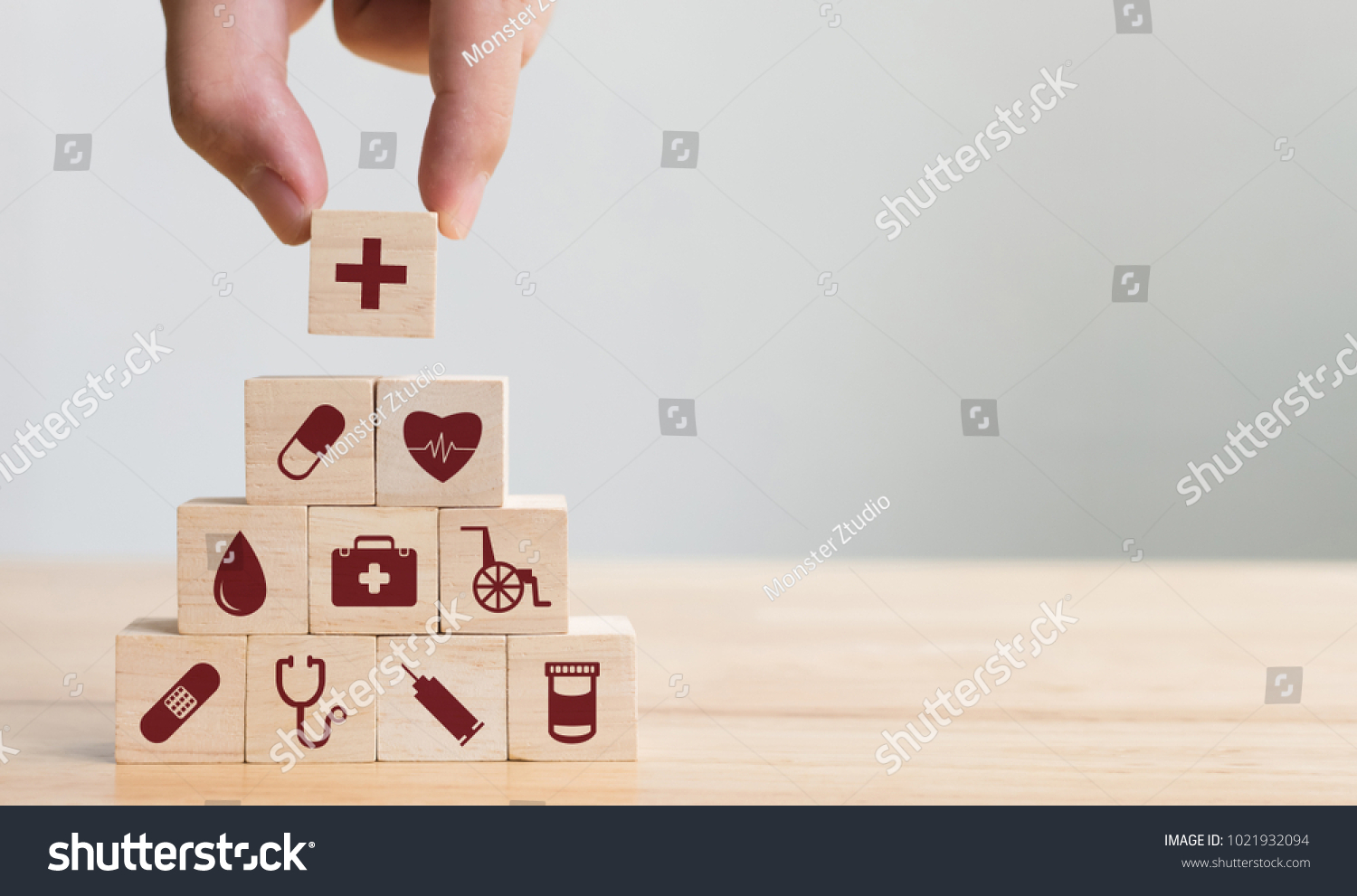 Hand arranging wood block stacking with icon healthcare medical, Insurance for your health concept #1021932094