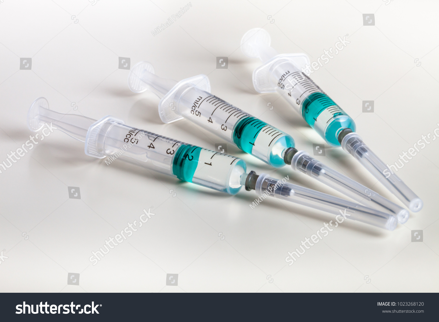 Several syringe on white table prepared for injection in hospital #1023268120