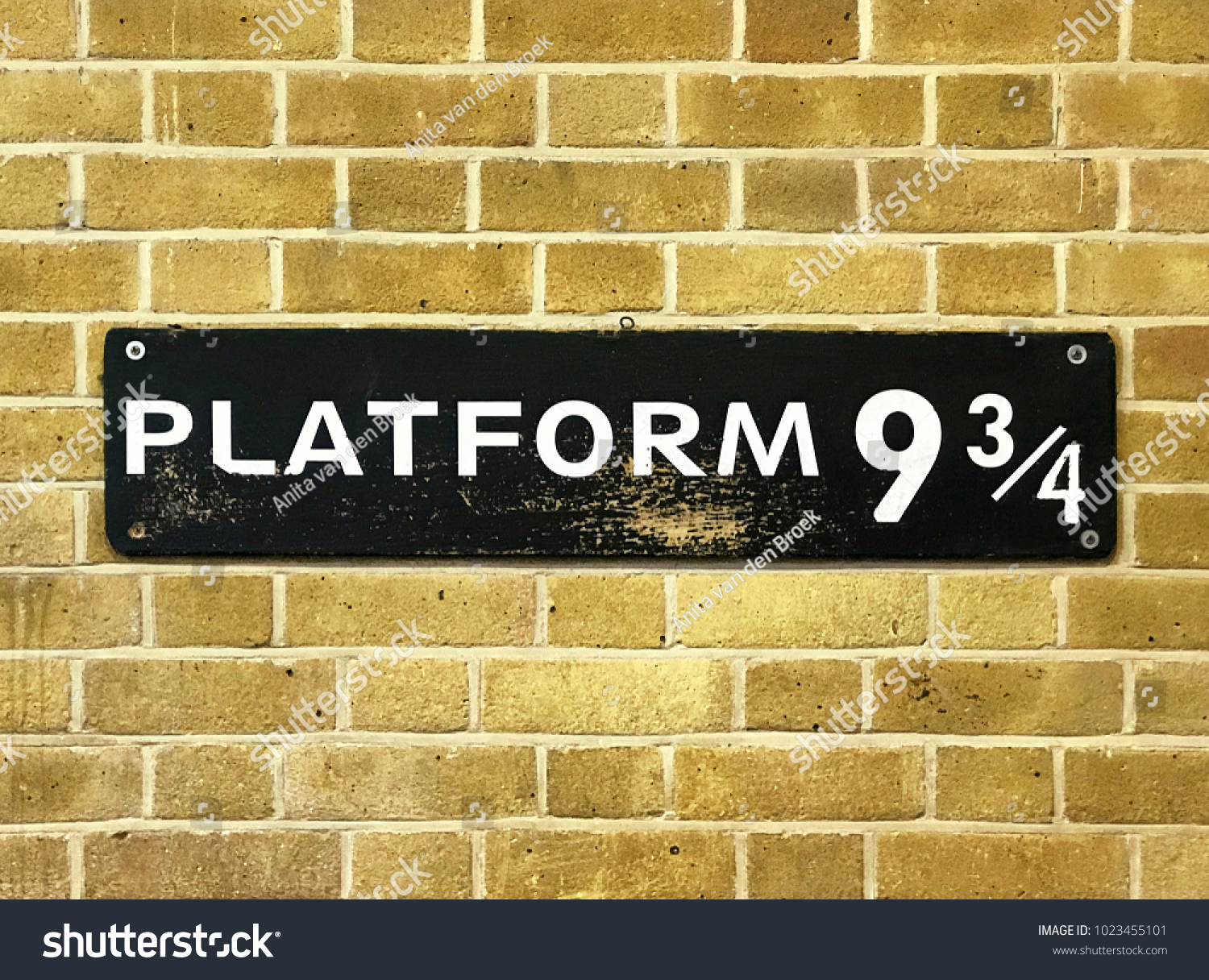 Close up of a 9 3/4 sign at Kings Cross Station. #1023455101