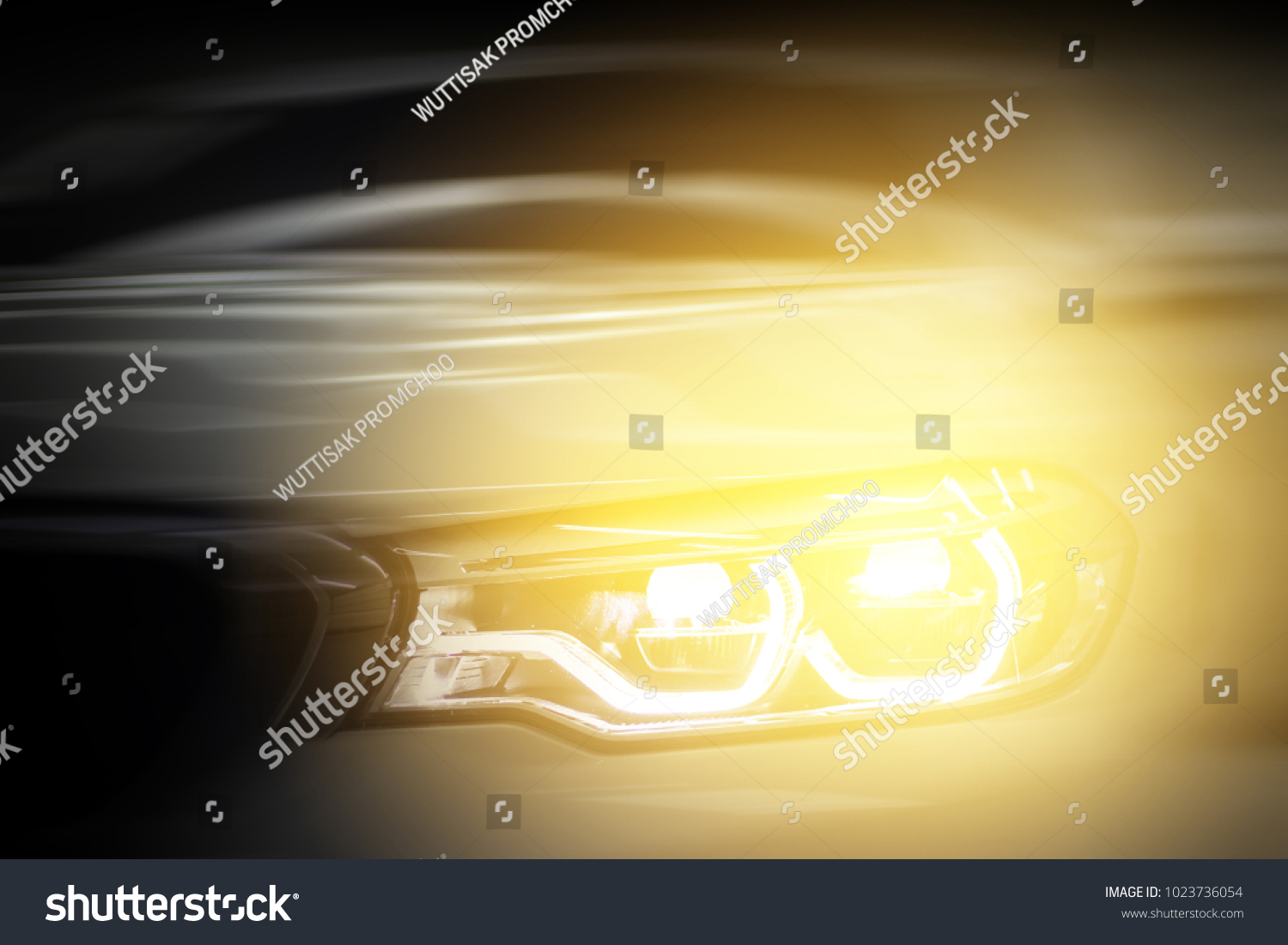 Headlight car.modern car headlight detail.motion blurred.selective focus. #1023736054