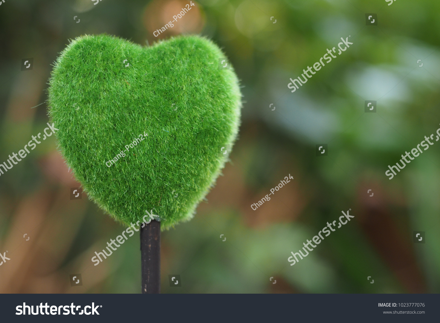 Tree of love./Green heart on nature background. #1023777076
