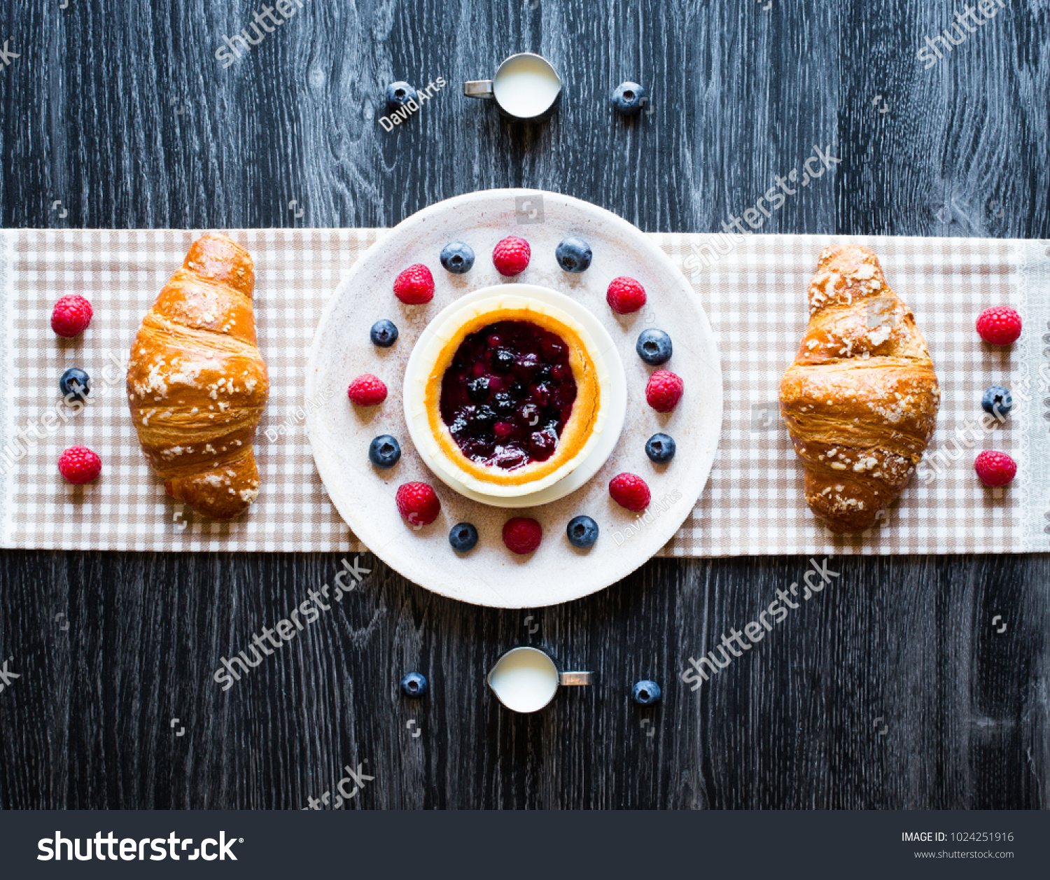 Top view of a wood table full of cakes, fruits, coffee, biscuits, spices and more breakfast classic sweet foods. #1024251916