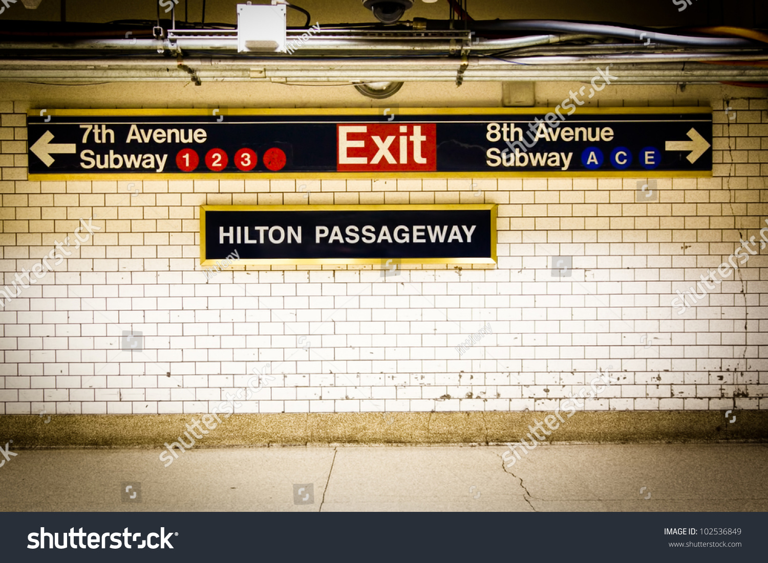 NYC Penn Station subway directional sign on tile wall #102536849