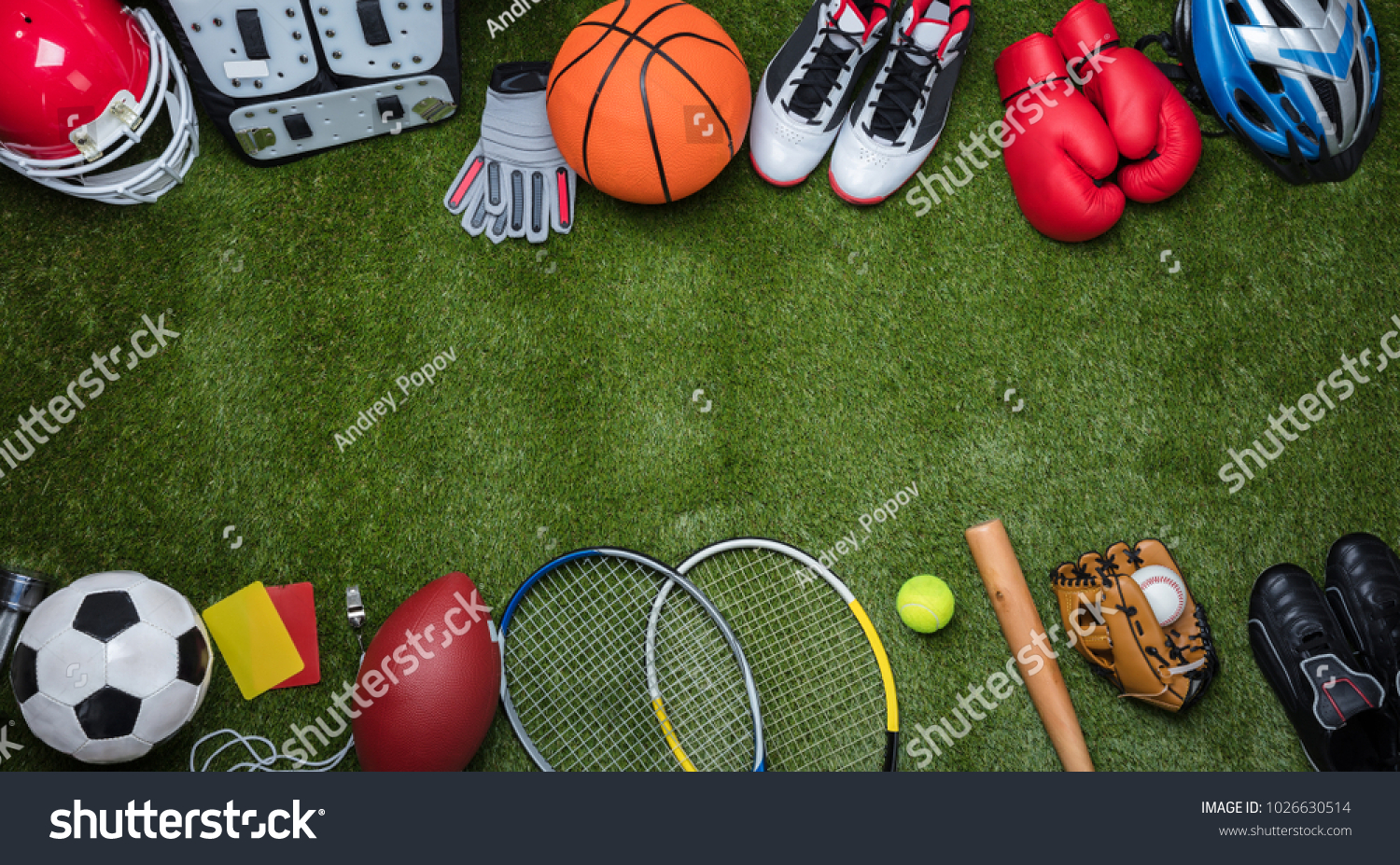 High Angle View Of Various Sport Equipments On Green Grass #1026630514