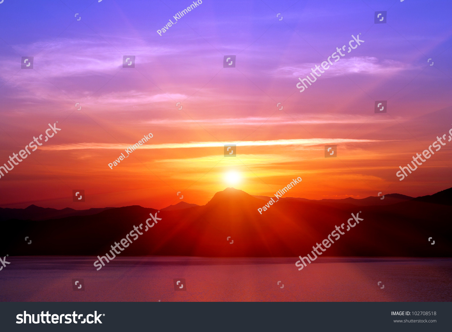 sunset over mountains near sea #102708518