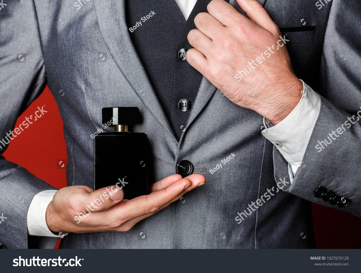 Fragrance smell. Male fragrance, perfumery, cosmetics. Smell perfume. Expensive suit. Rich man prefers expensive fragrance smell. Man scent perfume. Perfume or cologne bottle. Fashion cologne bottle. #1027676128