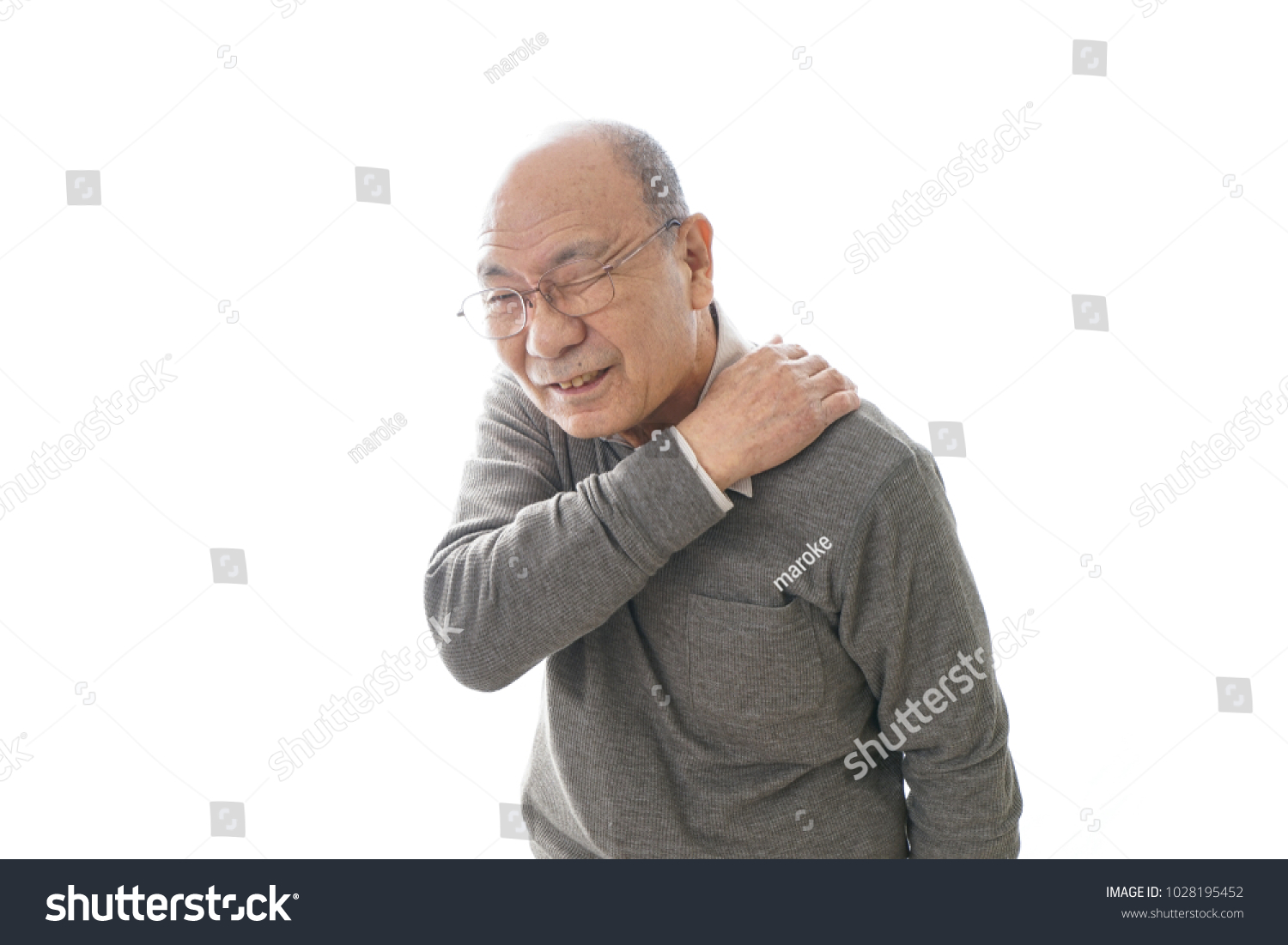 Aged man suffering from shoulder discomfort #1028195452