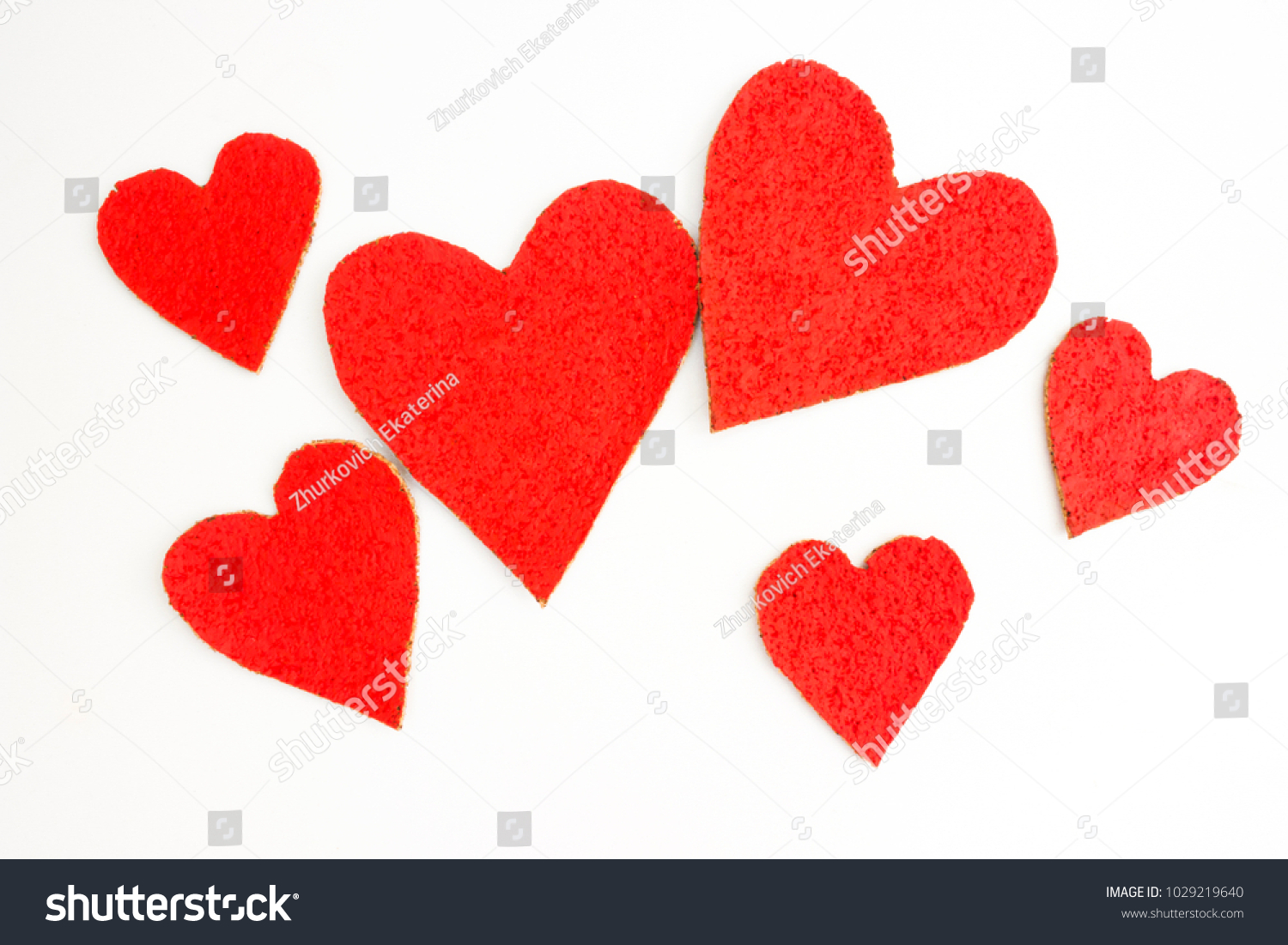 Bright red hearts of different sizes #1029219640