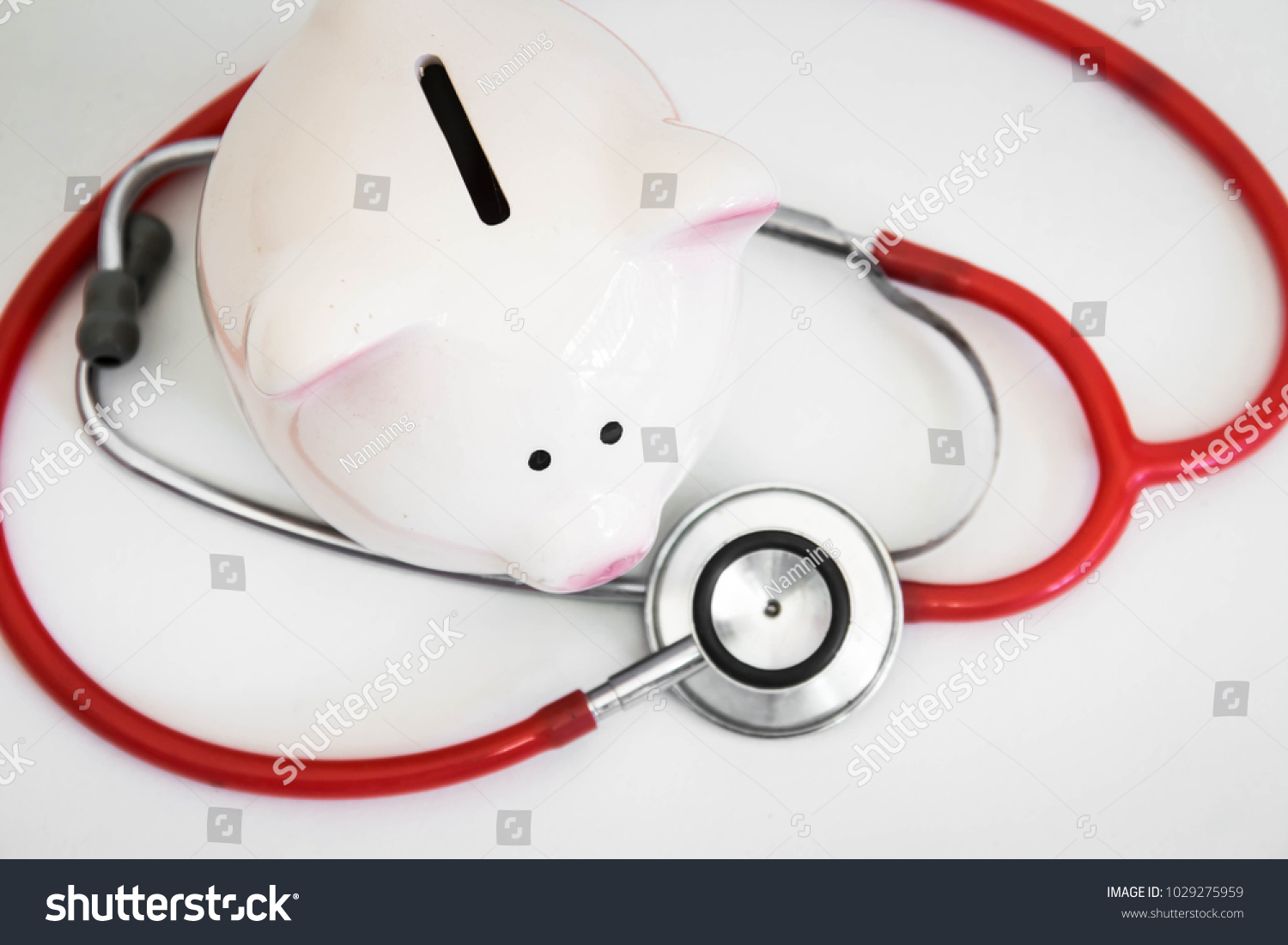 Piggy bank with stethoscope,Financial health #1029275959
