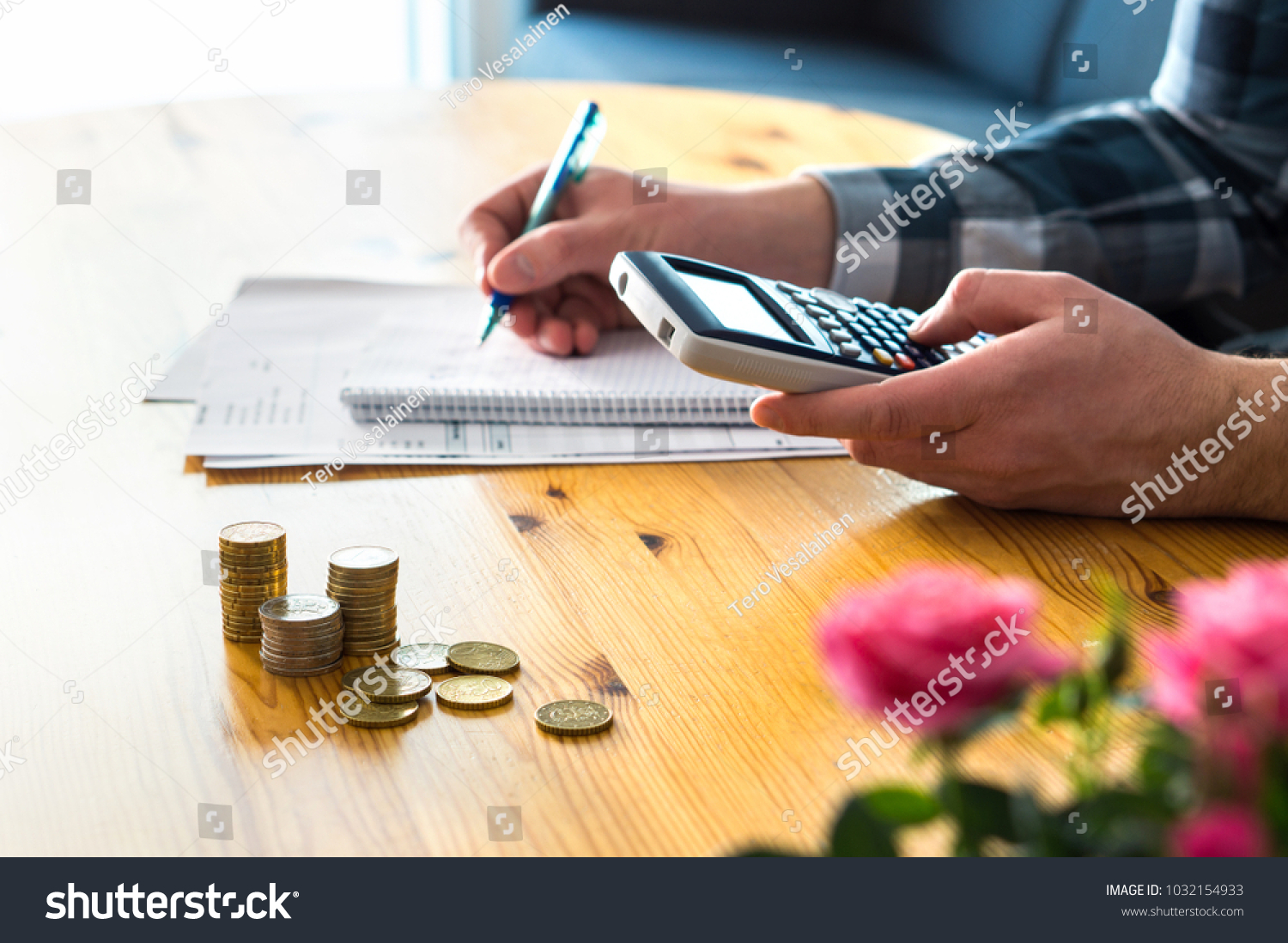 Man using calculator and counting budget, expenses and savings. Low income family living cost and rising prices concept. Calculating and budgeting. Making retirement plan. Writing notes on paper.  #1032154933