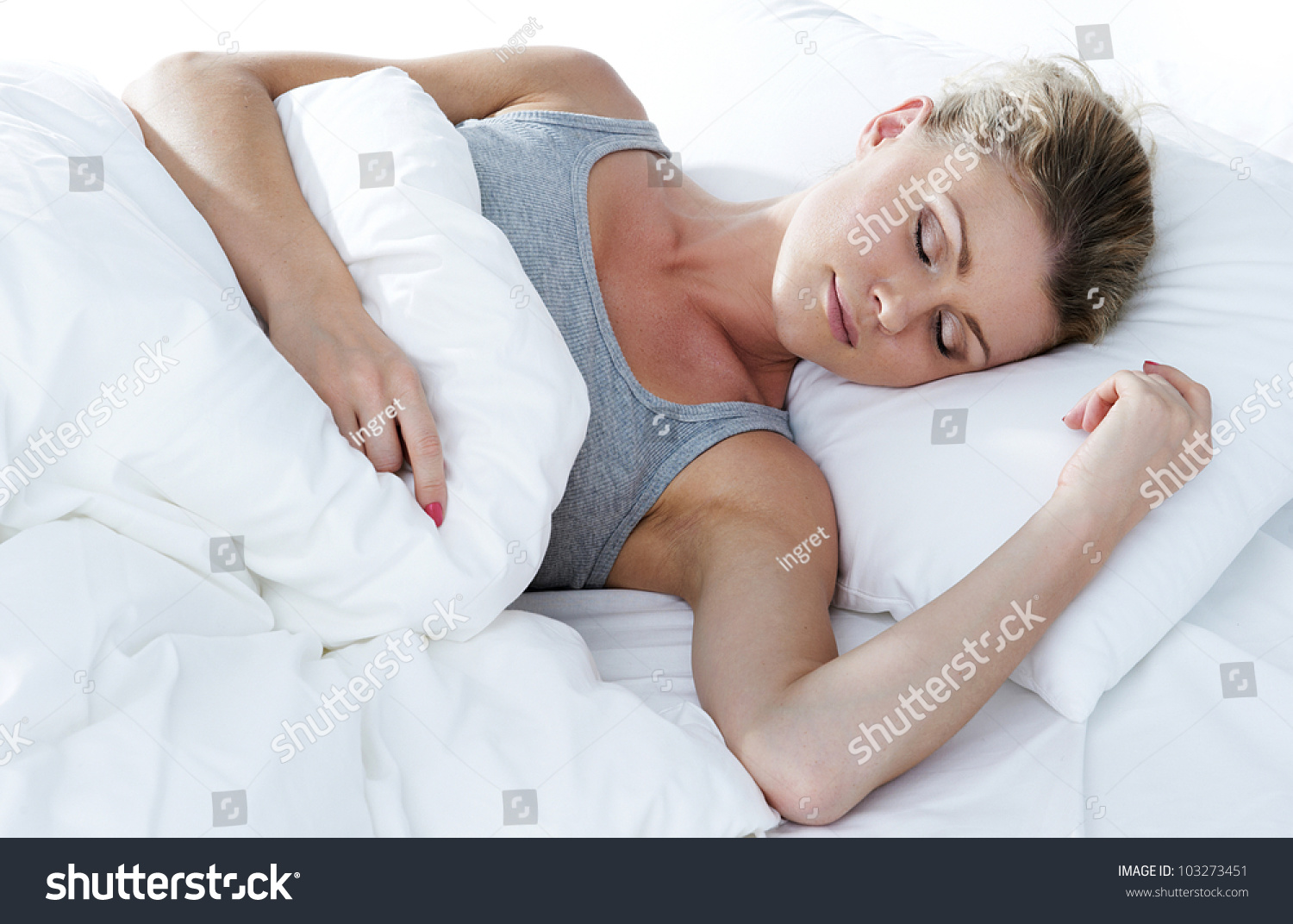 Closeup portrait of a cute young woman sleeping on the bed #103273451