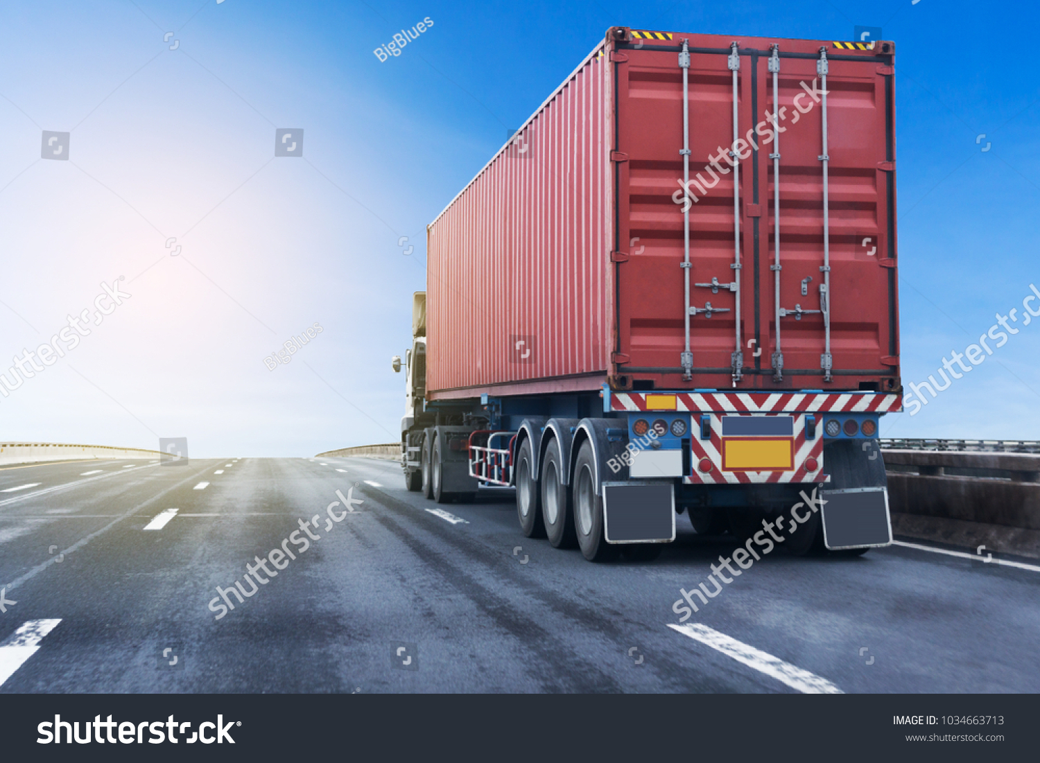 White Truck on highway road with red  container, transportation concept.,import,export logistic industrial Transporting Land transport on the asphalt expressway #1034663713