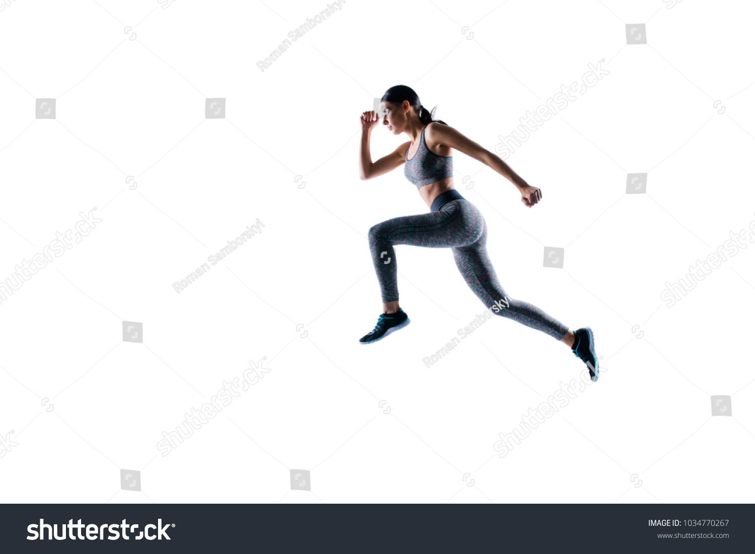 Ready steady go! Concept of endurance strength persistence in sport. Full length full size portrait of beautiful sporty energetic active purposeful sportswoman running and jumping, natural light #1034770267