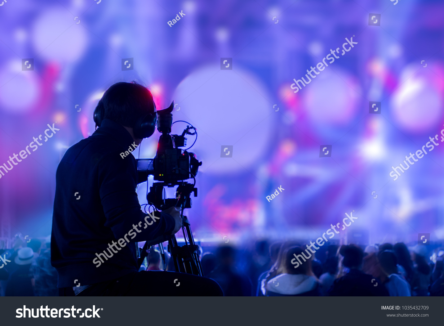 The filmmaker is recording and broadcasting live concerts on camcorders. Professional Video Recording Business #1035432709