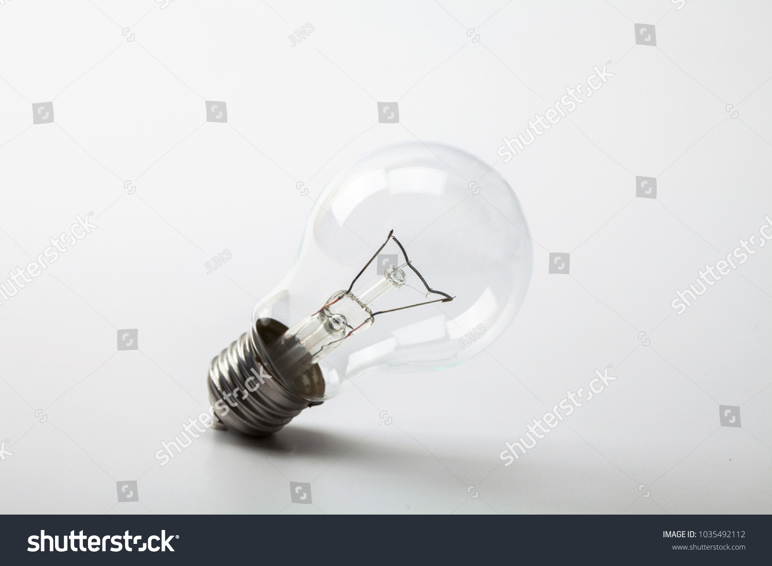 Light bulb on a white bckground #1035492112