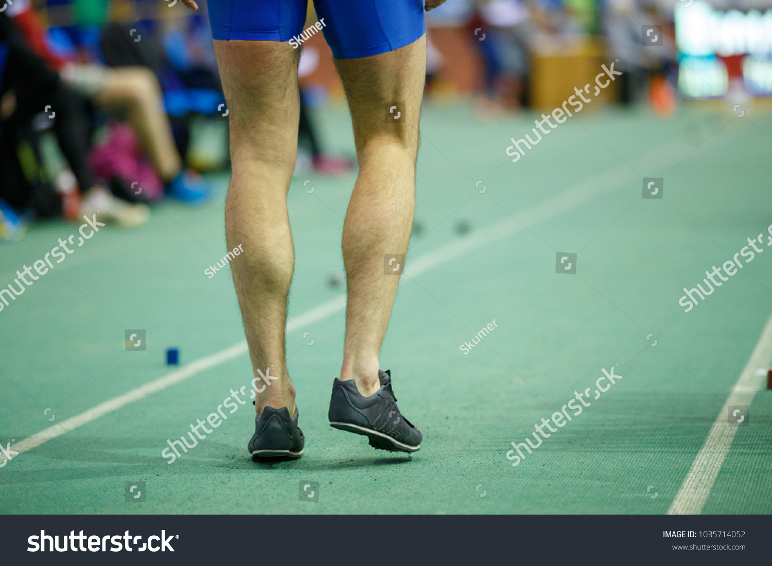 Sportsman getting ready in long jump competition. Track and field competitions concept background #1035714052