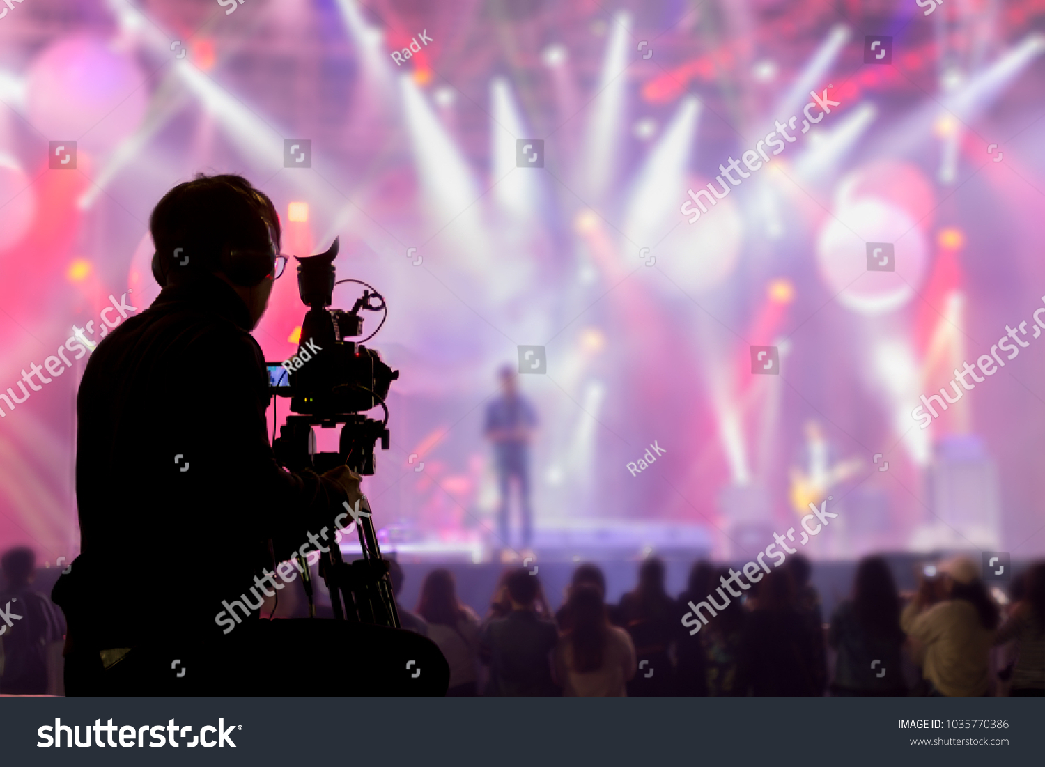 The filmmaker is recording and broadcasting live concerts on camcorders. Professional Video Recording Business #1035770386