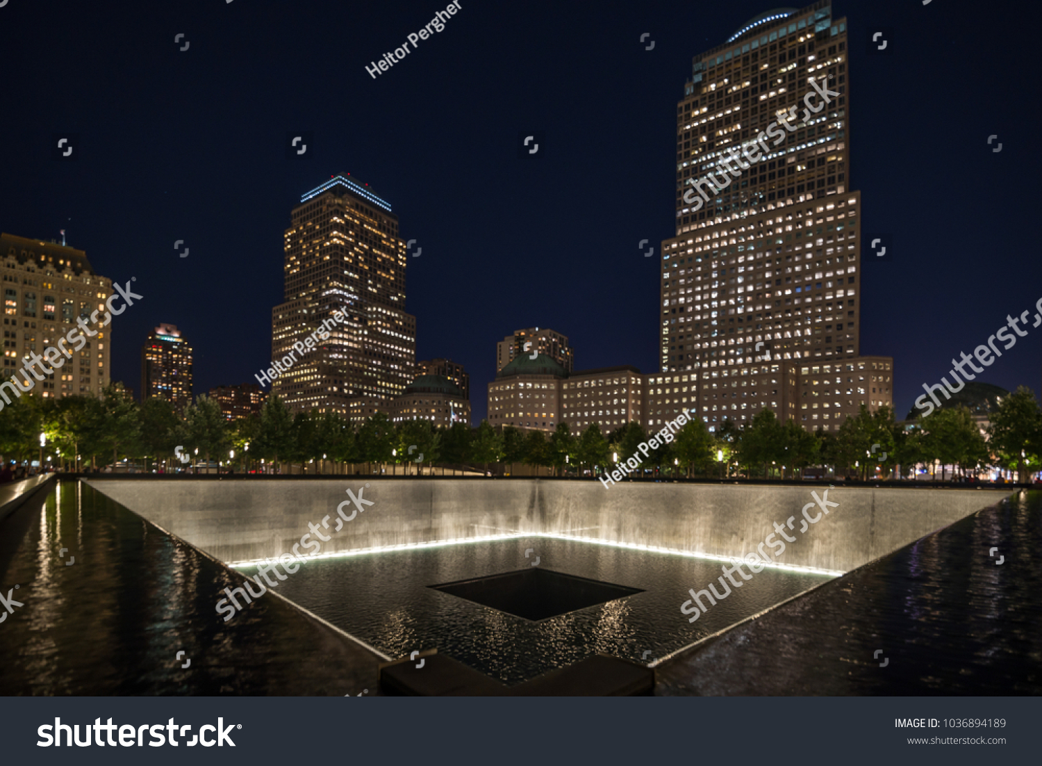 9 11 memorial shot at night with building in the back #1036894189