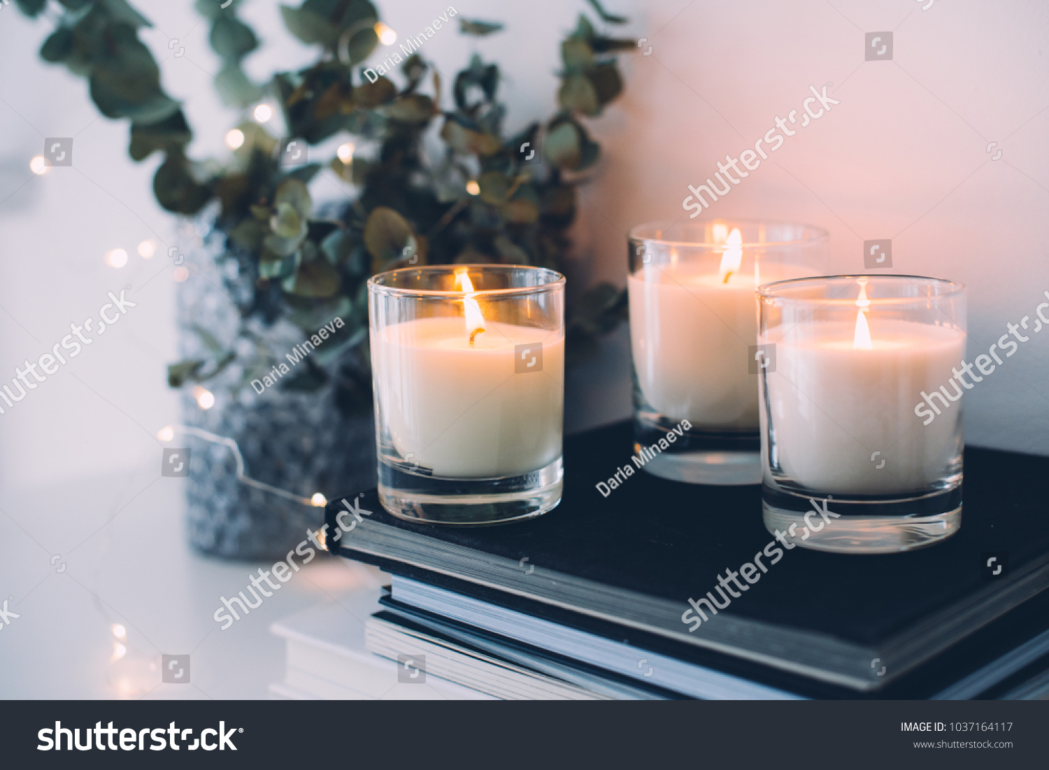 Cozy home interior decor, burning candles #1037164117