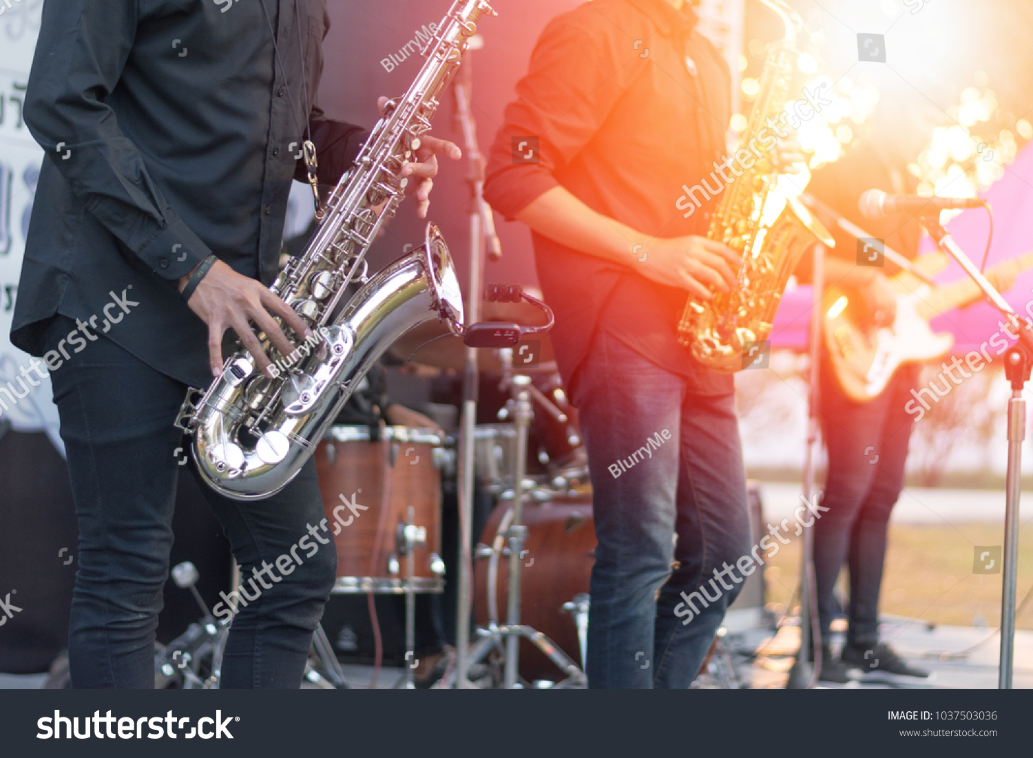 World Jazz festival. Saxophone, music instrument played by saxophonist player and band musicians on stage in fest. #1037503036