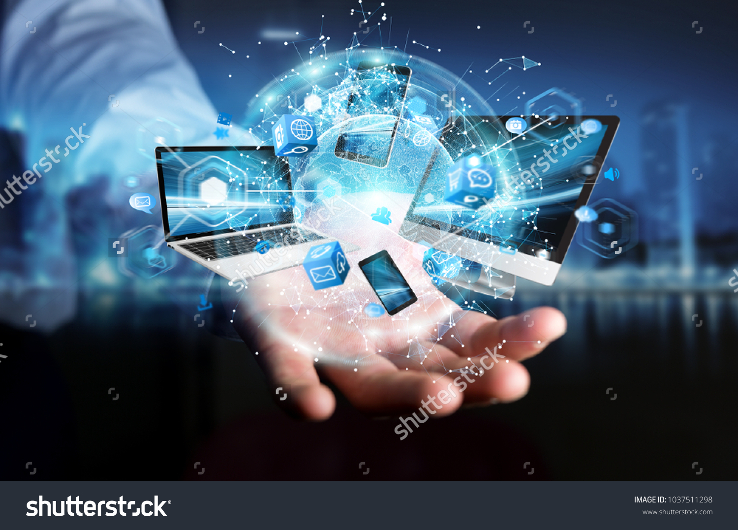 Tech devices connected to each other by businessman on blurred background 3D rendering #1037511298