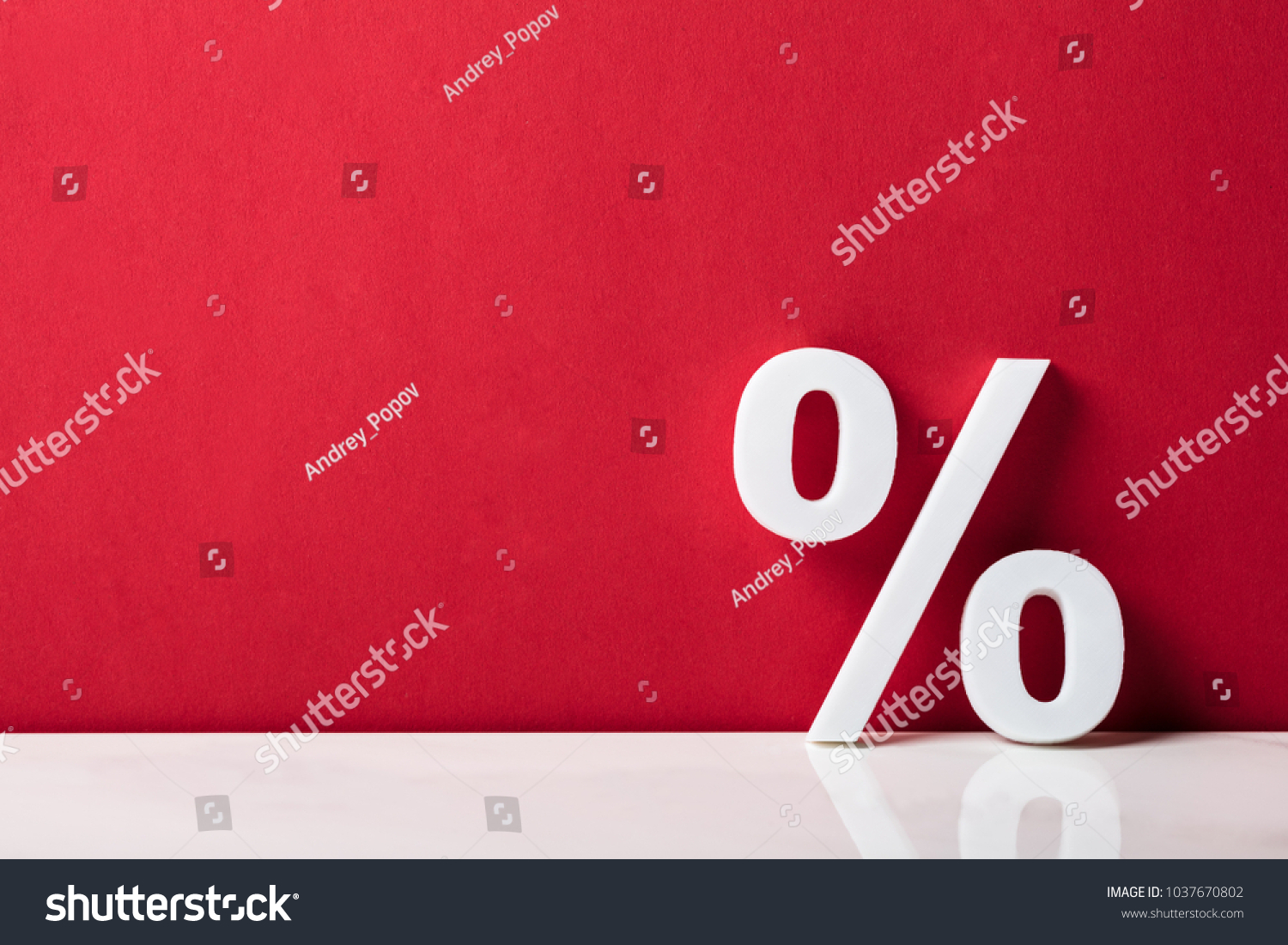 Close-up Of A Percentage Sign Leaning On Red Wall #1037670802
