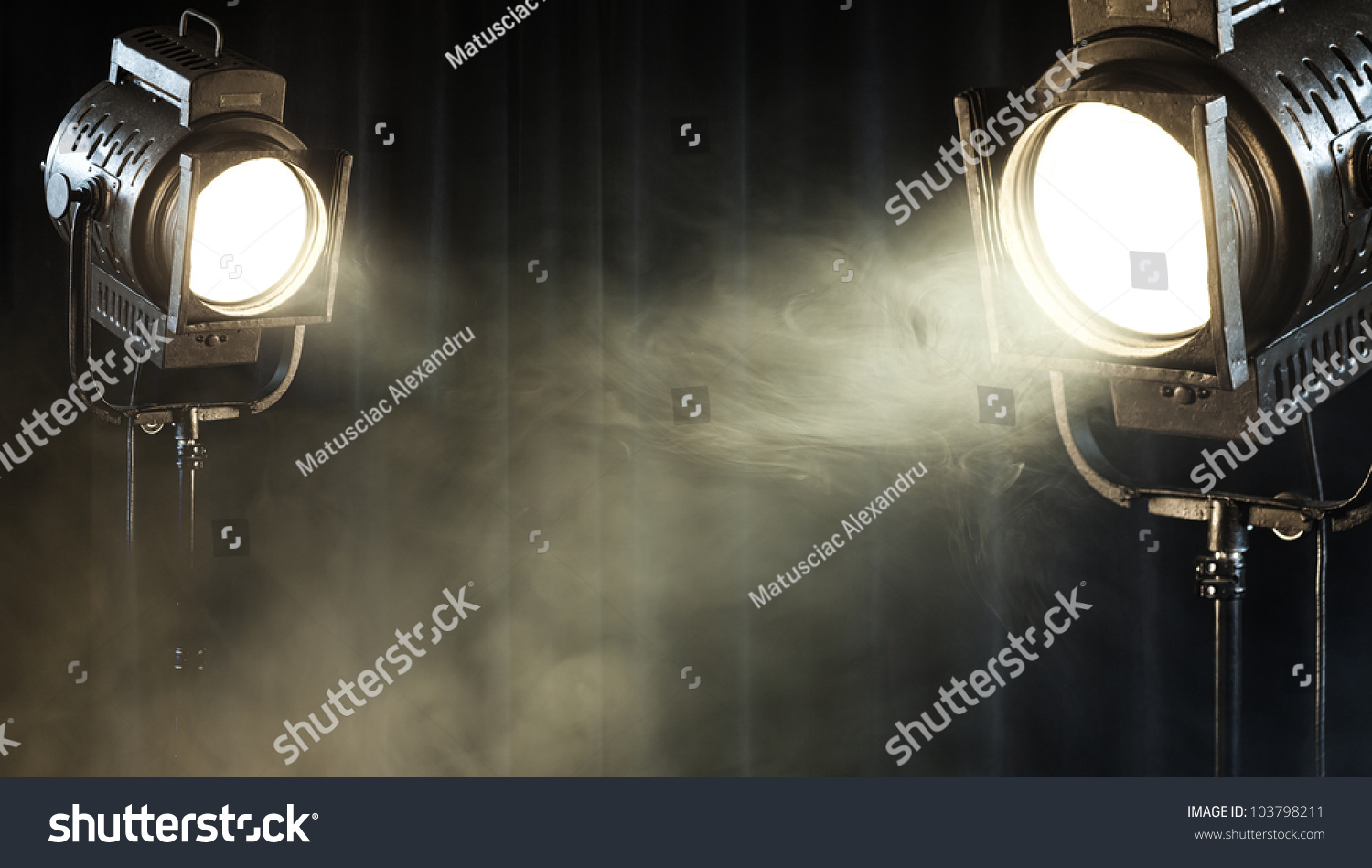 theater spot lights on black curtain with smoke #103798211