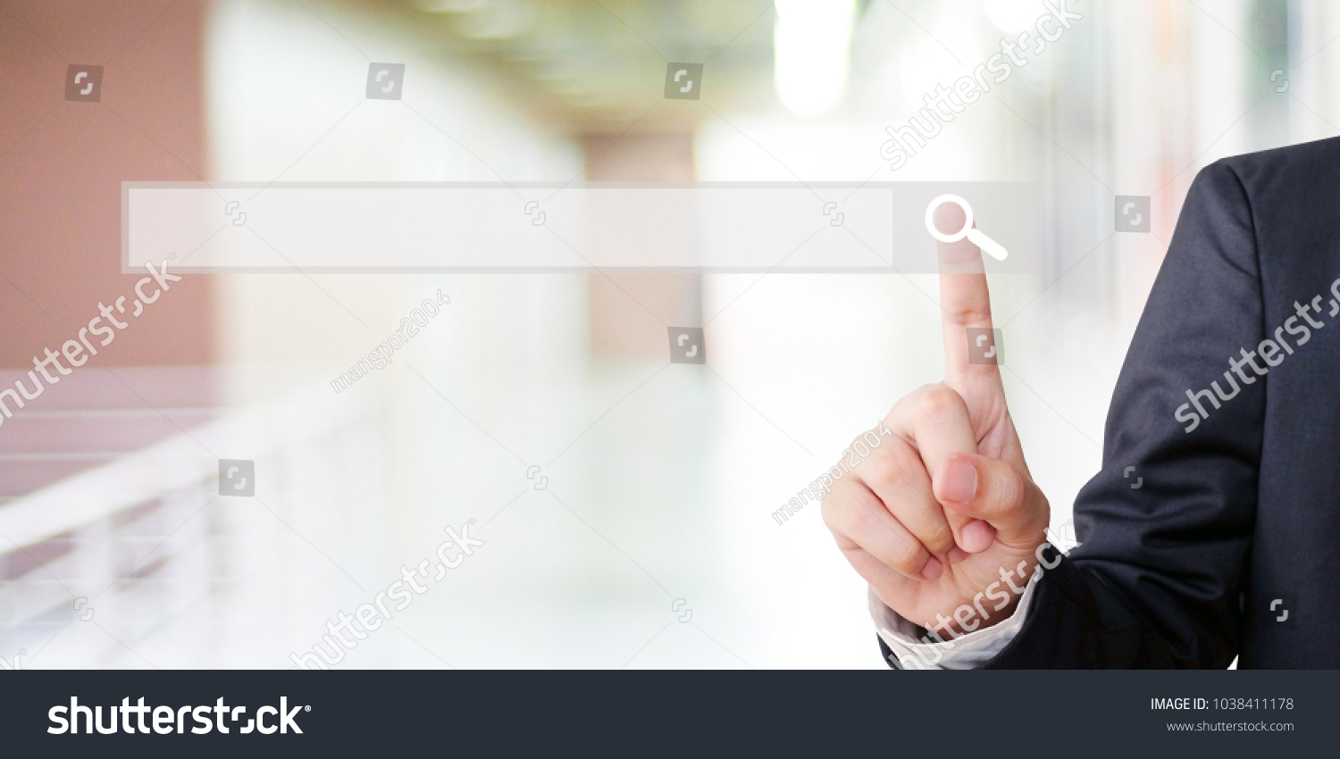 Businessman hand touching blank search bar over blur background, business and technology concept, search engine optimization, web banner #1038411178